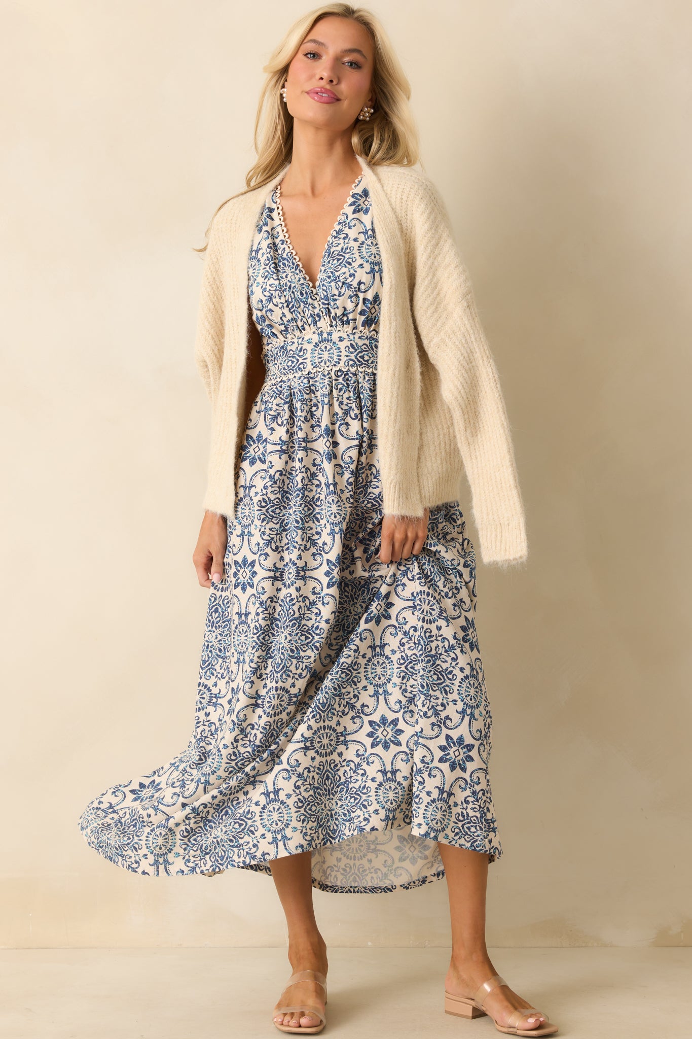 Front view emphasizing the smooth drape of the fabric, the fitted waistband, and the sleeveless bodice.