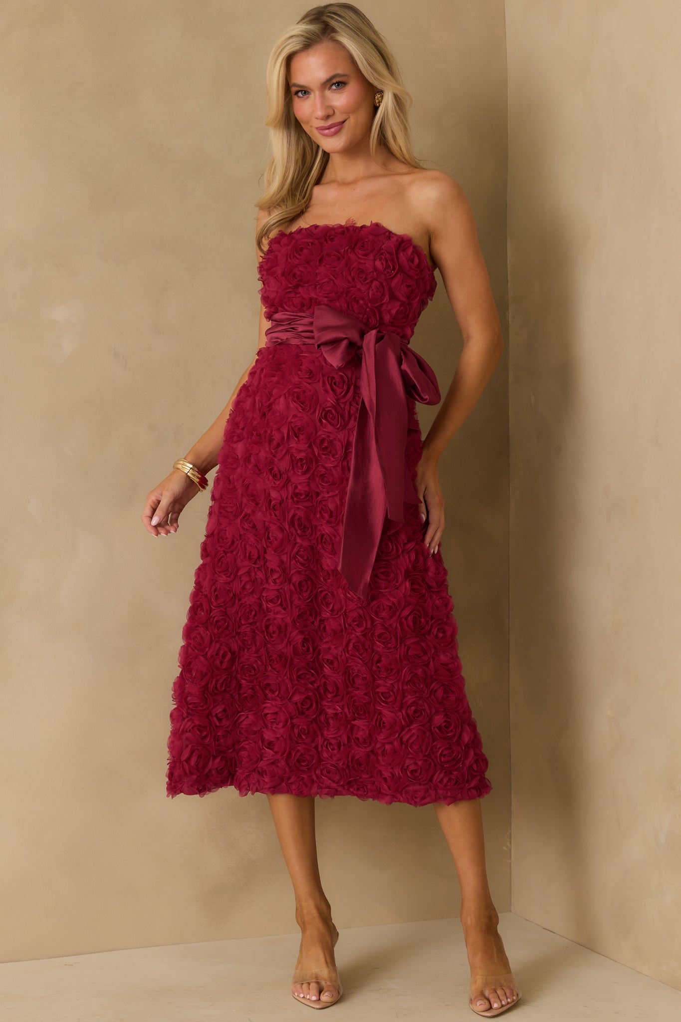 Front-facing view showcasing floral applique detailing throughout the fabric.