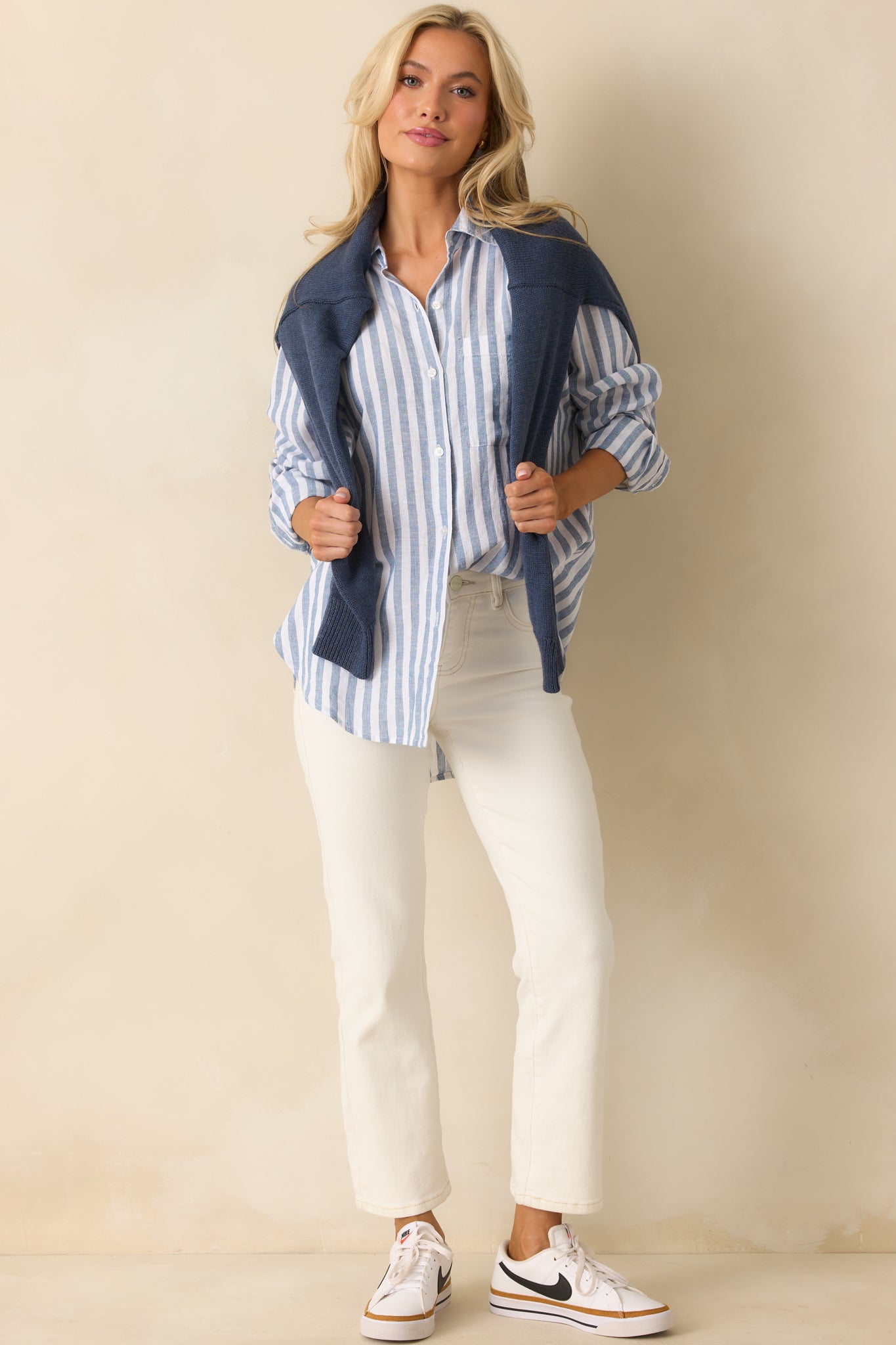 Front view of the striped top, featuring a functional breast pocket and lightweight linen blend fabric.