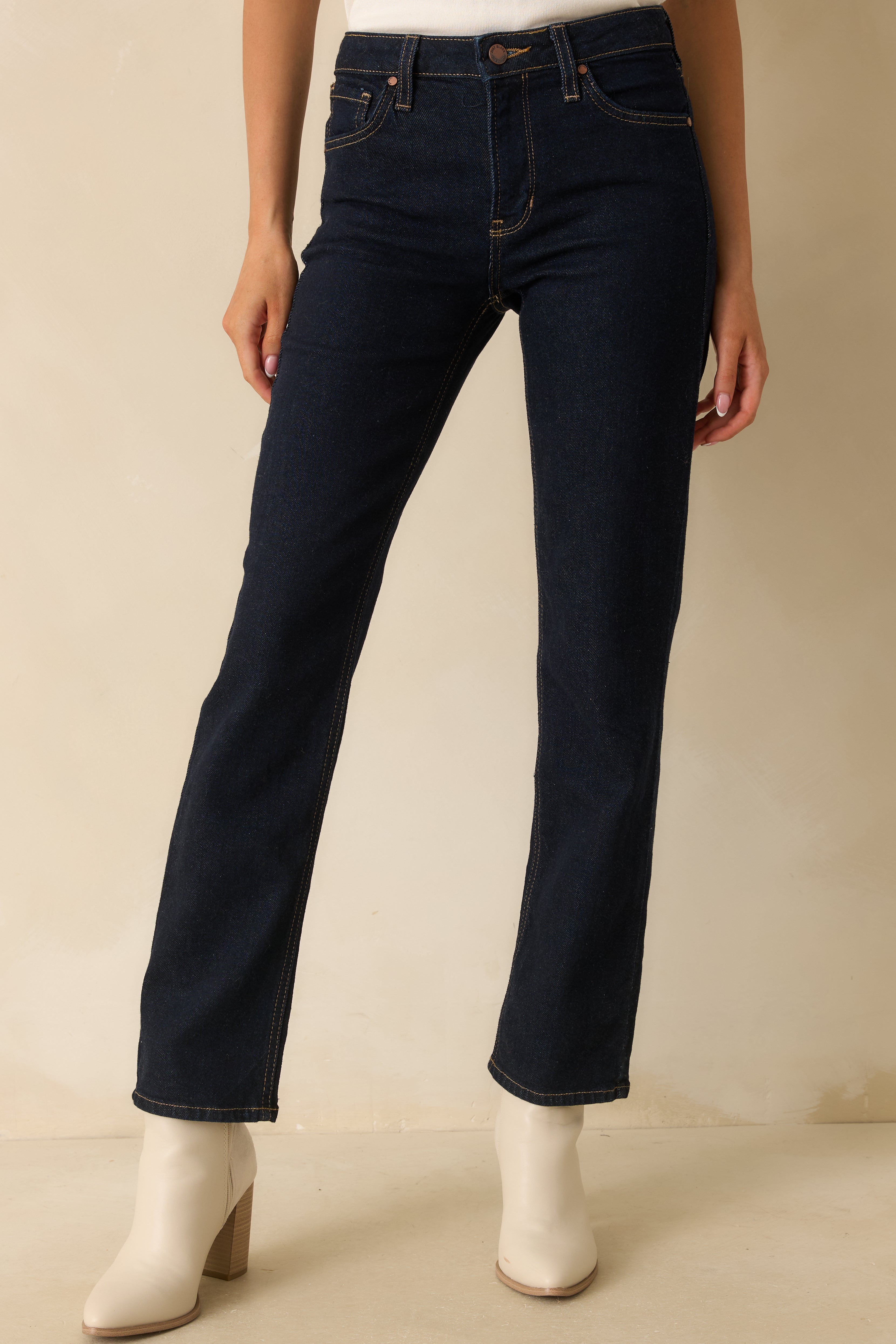 Cropped front view focusing on the high-rise waistband, front pockets, and smooth cotton-blend fabric.