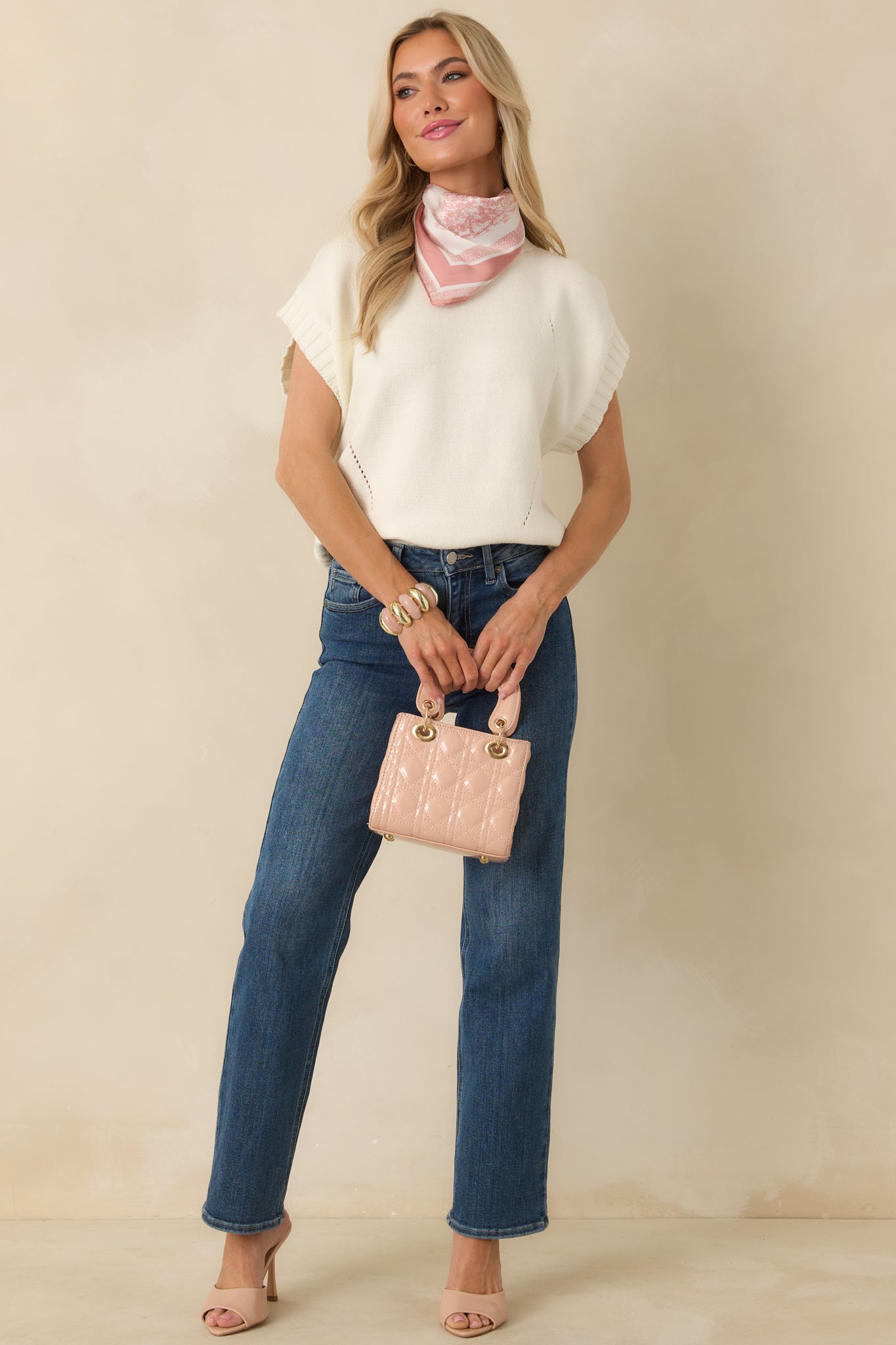 Full length front view focusing on the mock neckline and structured yet relaxed shape.