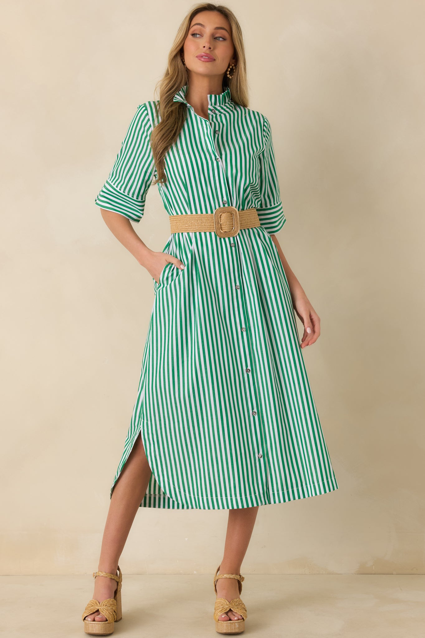 Front view of green striped shirt dress with a relaxed shape and softly gathered skirt movement.