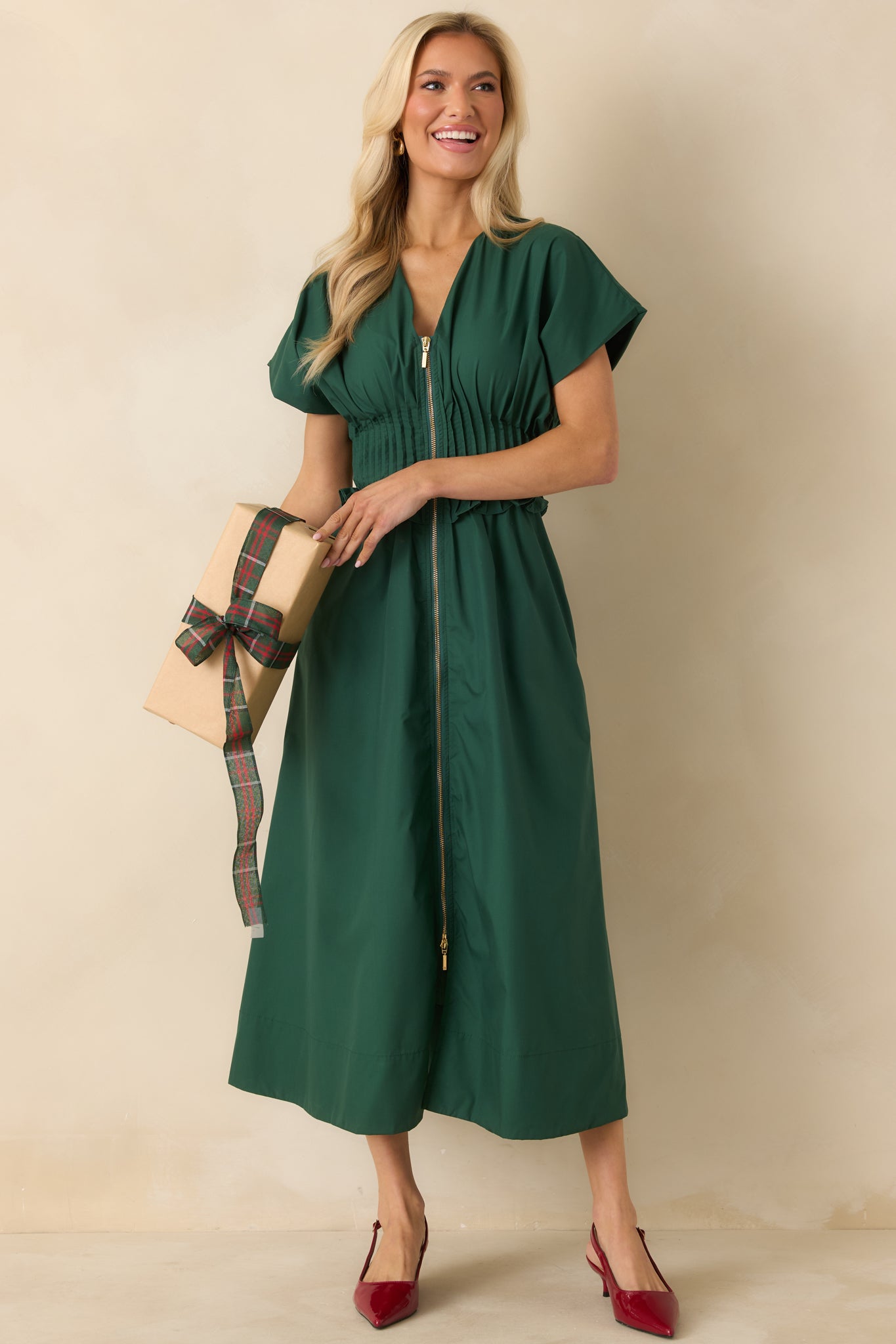 Front view of green woven maxi dress with V-neckline, short sleeves, and relaxed A-line skirt.