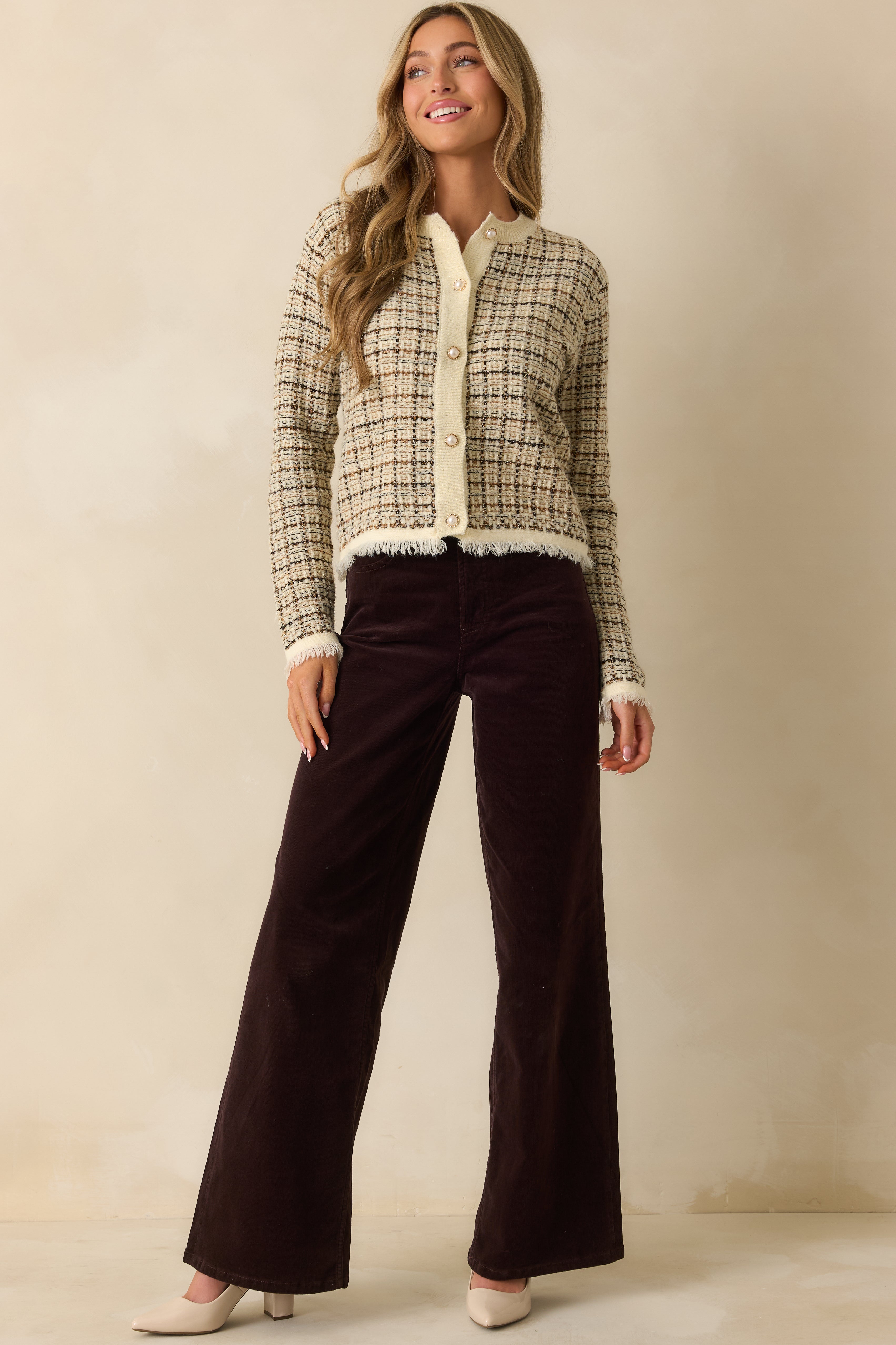 High-rise corduroy jeans in deep brown, featuring full-length front view with belt loops and pockets.