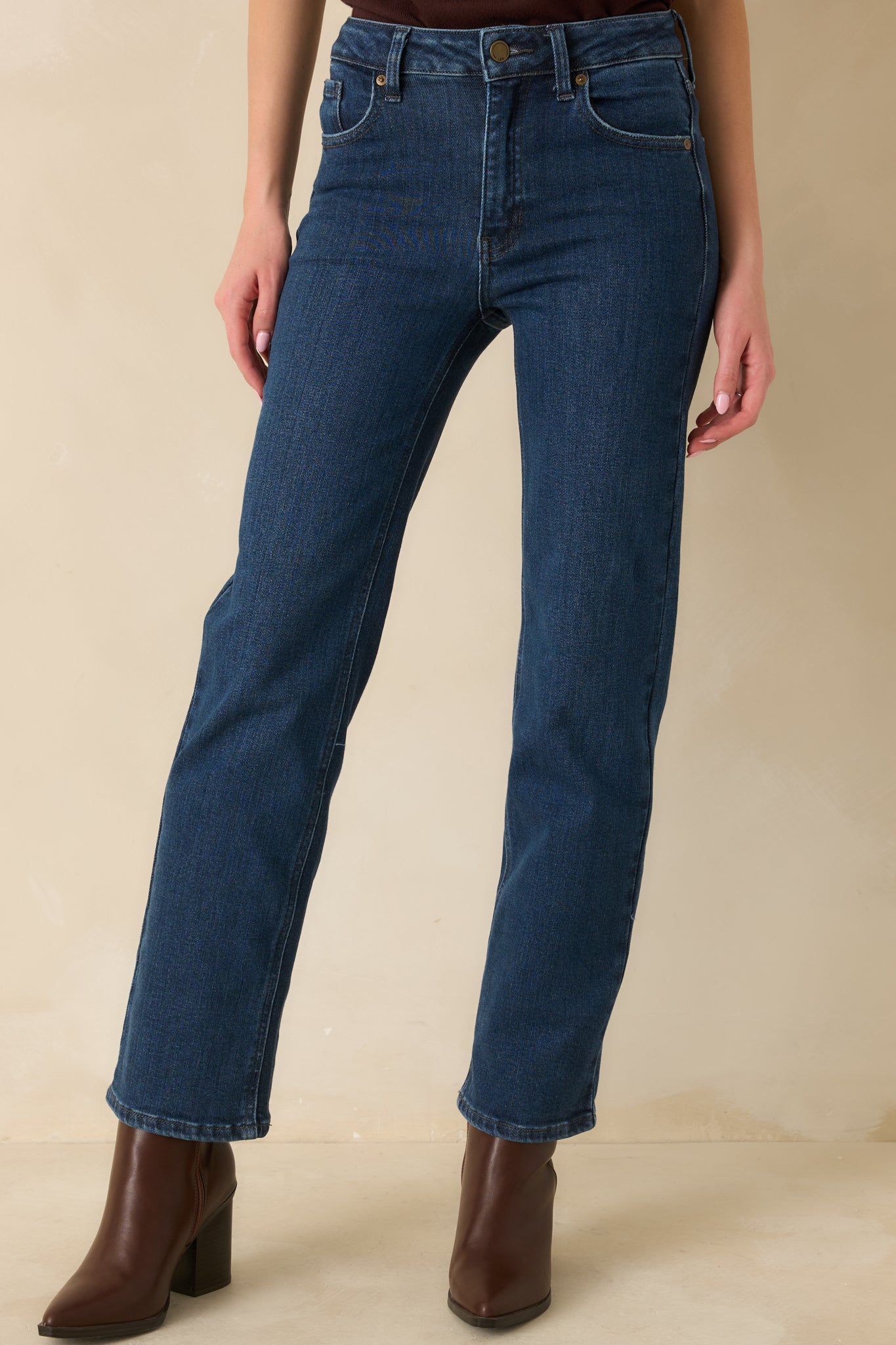 Front view focusing on the high-rise waistband with belt loops and button closure.