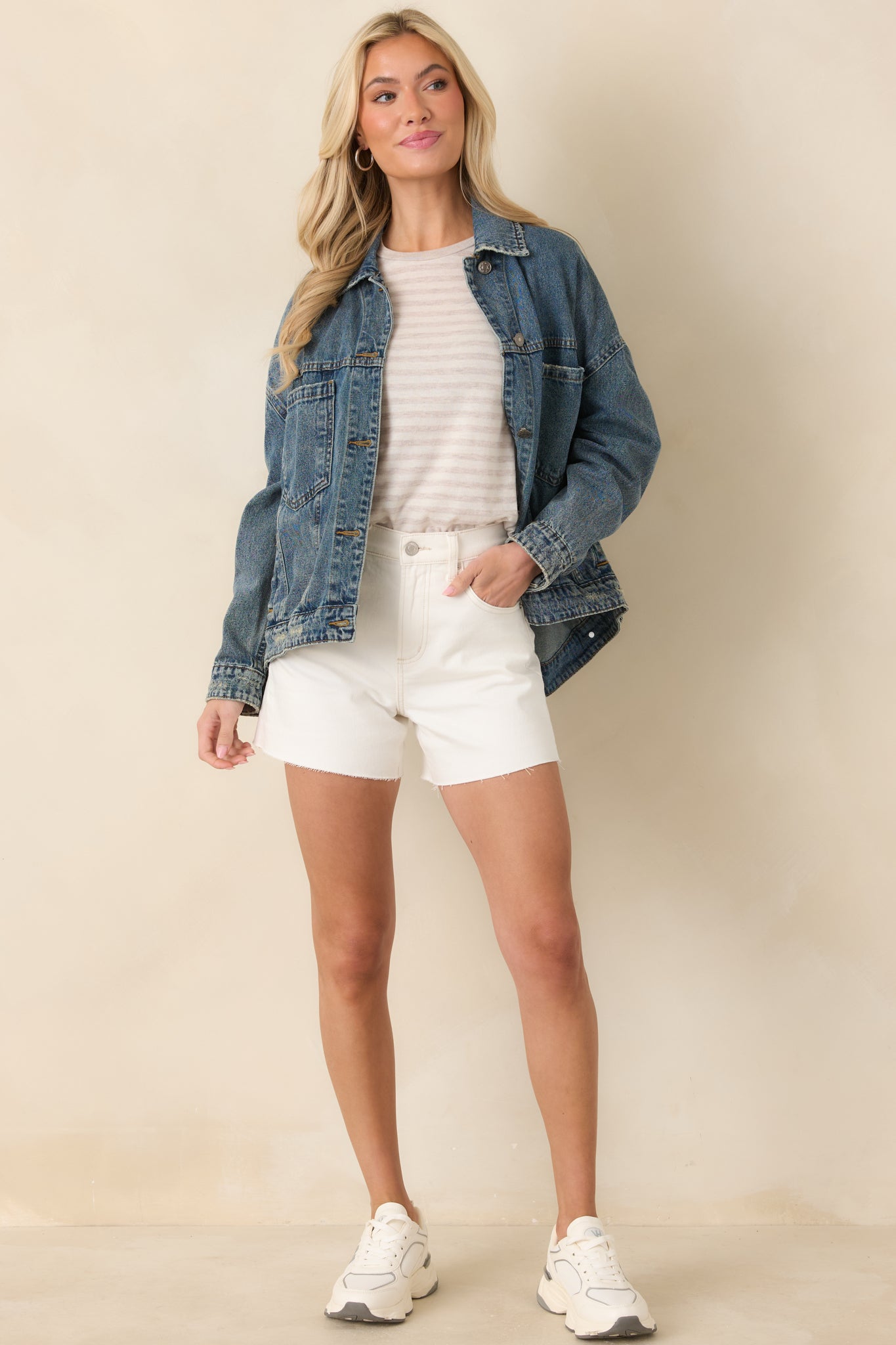 Front-facing view highlighting the relaxed, slightly oversized fit and classic denim construction.