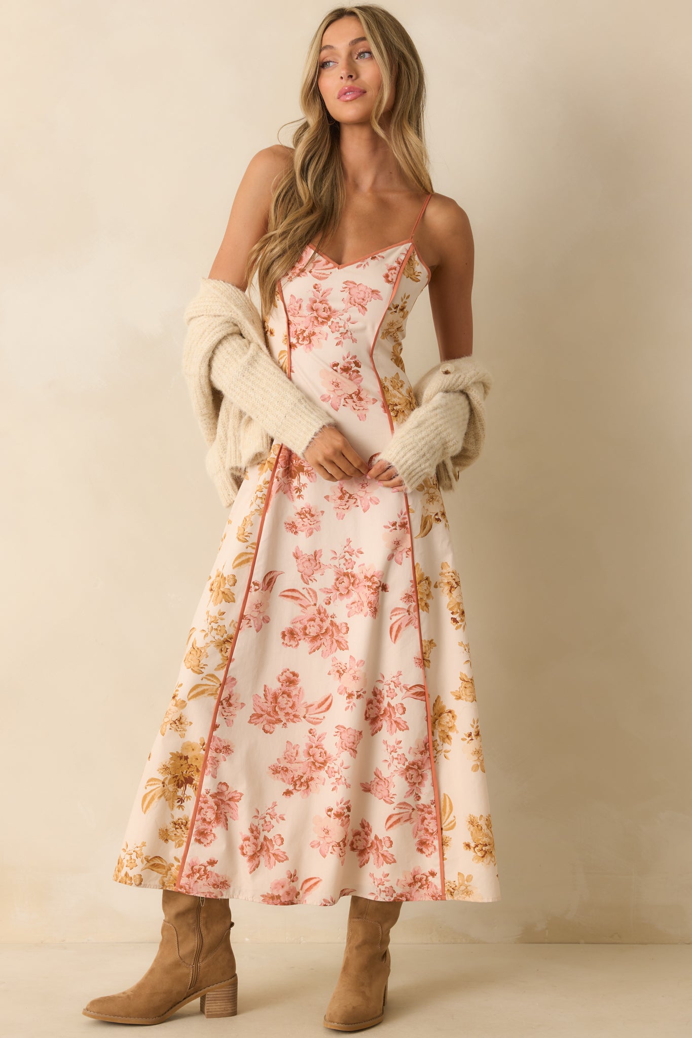 A full front view of the maxi dress featuring rose pink and honey yellow floral print panels with clay trim detailing.