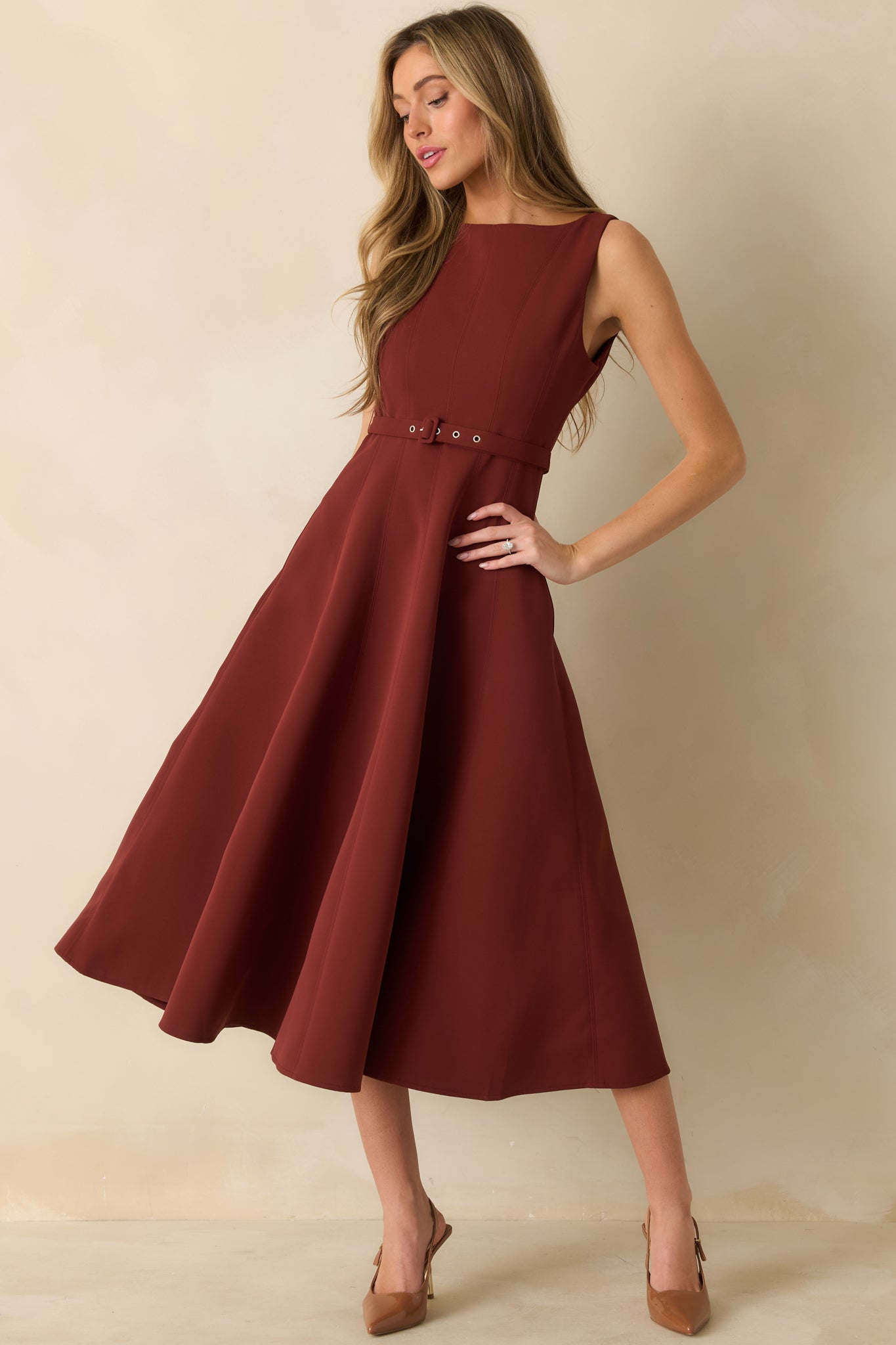 Front view of midi dress featuring adjustable matching waist belt and smooth flared silhouette.