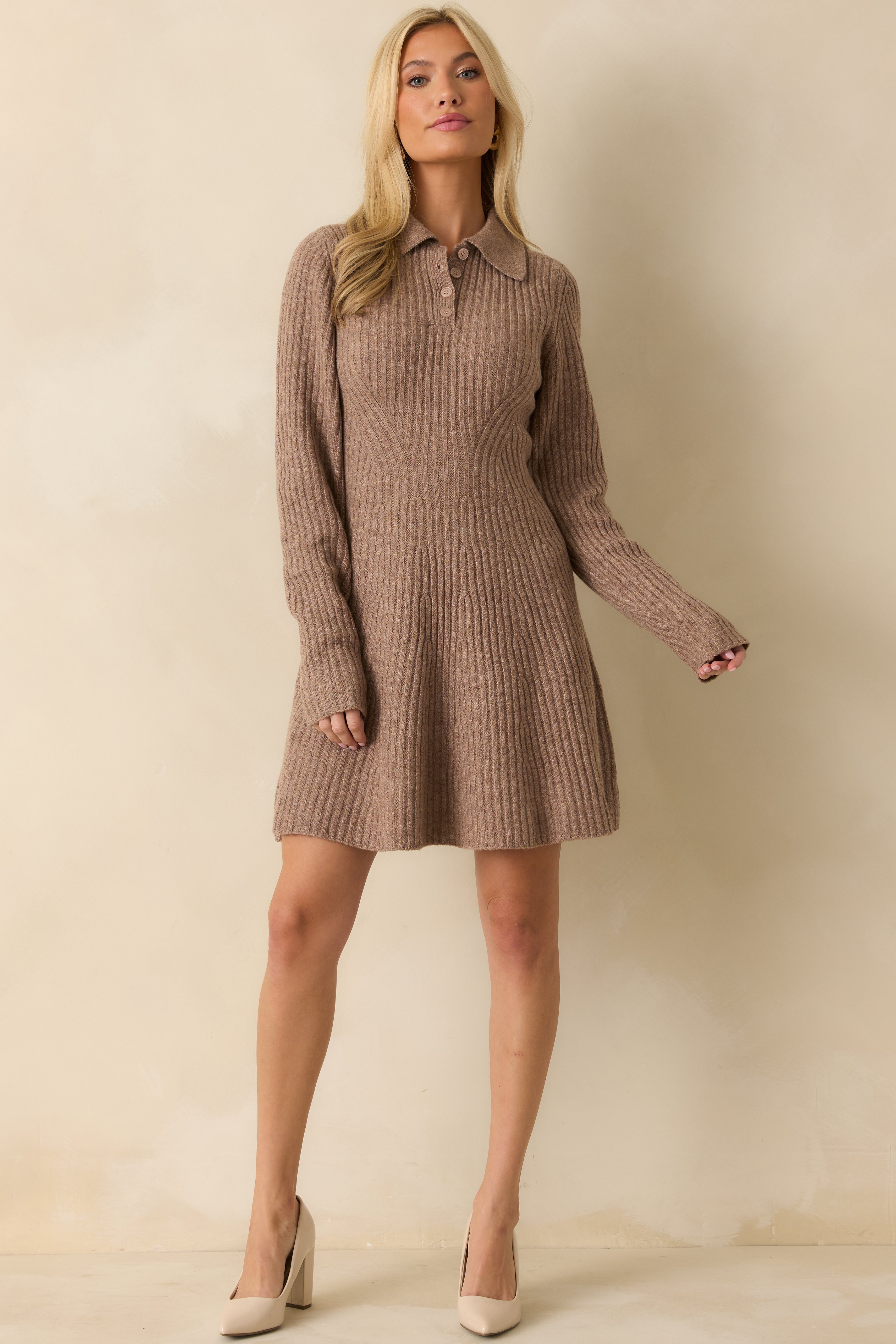 Front view of a fitted mocha knit dress featuring long sleeves, flared hem, and collar with button detailing.