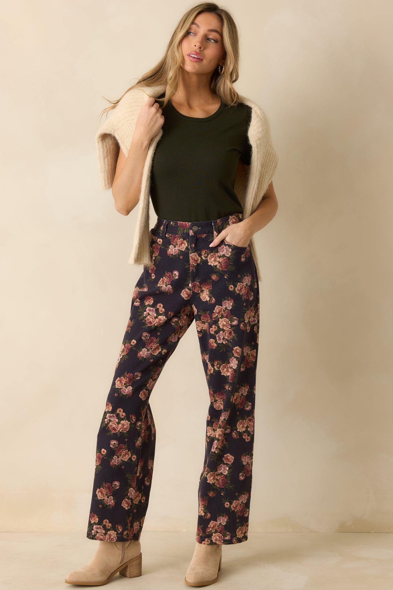 Front view of navy floral jeans showing functional front pockets and a relaxed straight-leg fit.