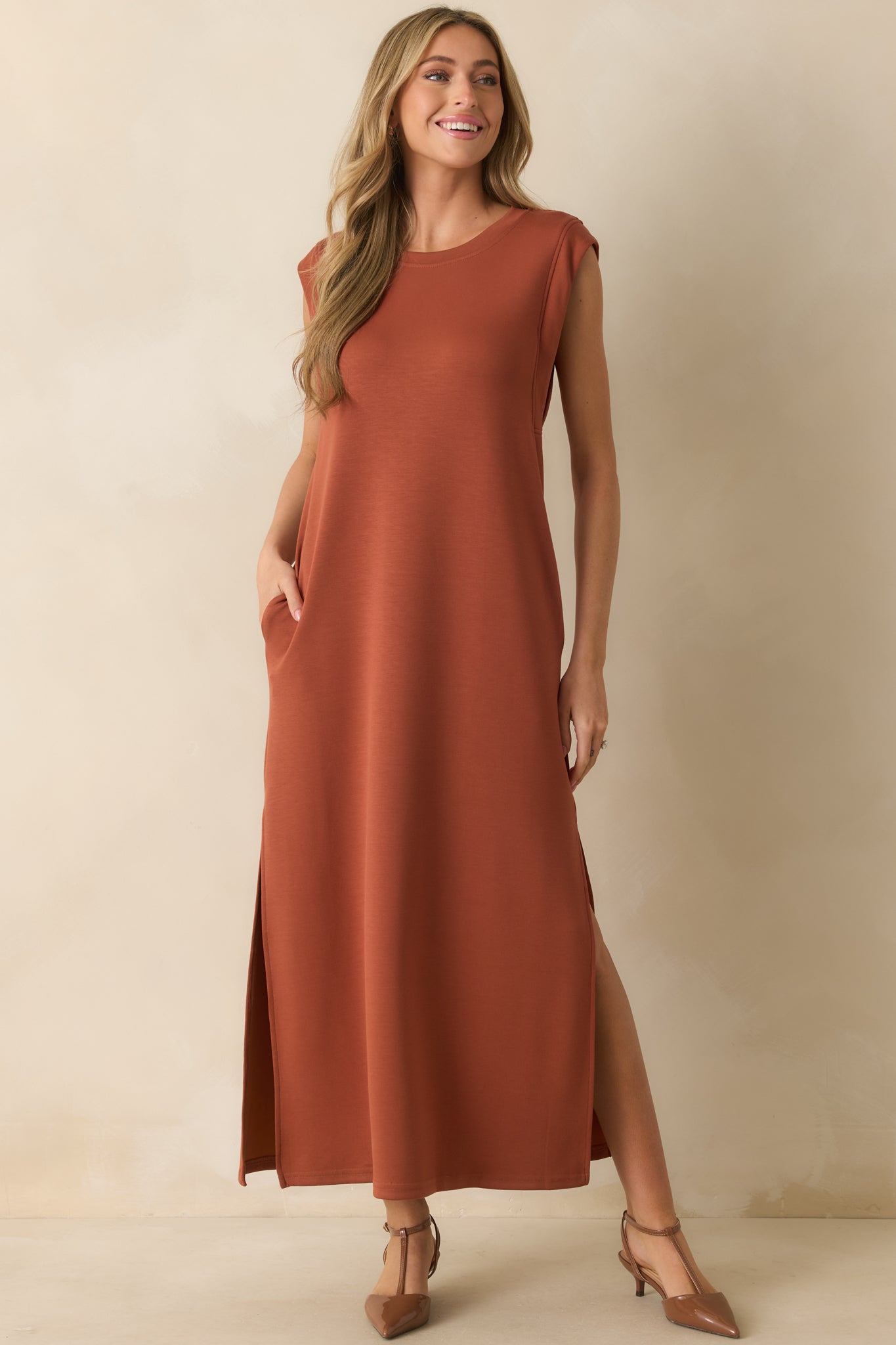 Front view of a maxi dress in soft cotton blend fabric featuring short sleeves and functional side pockets.