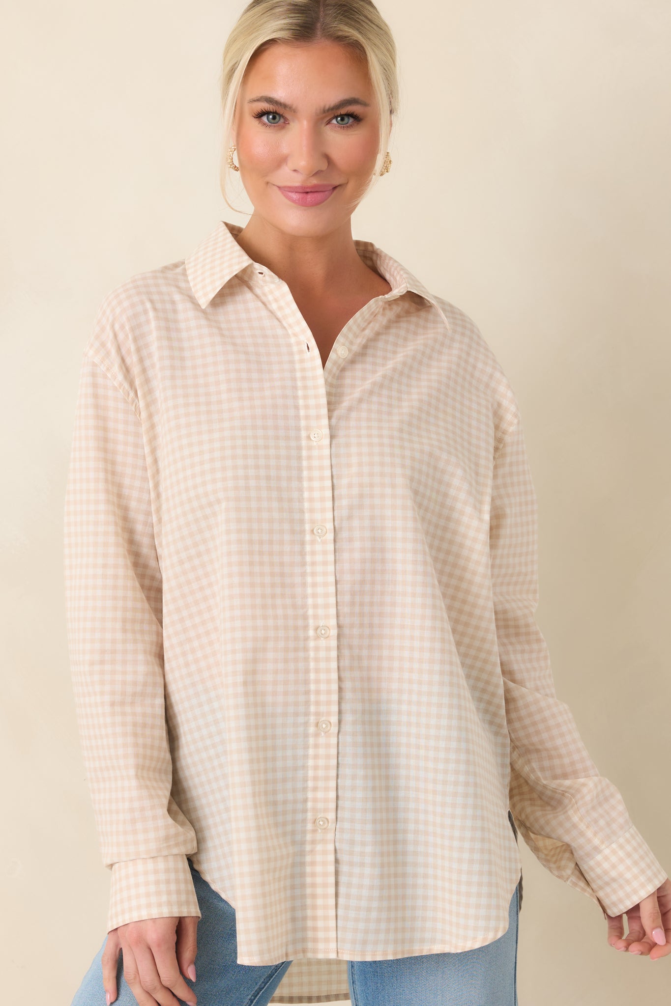 Close front view of beige gingham top with a structured collar and soft drape