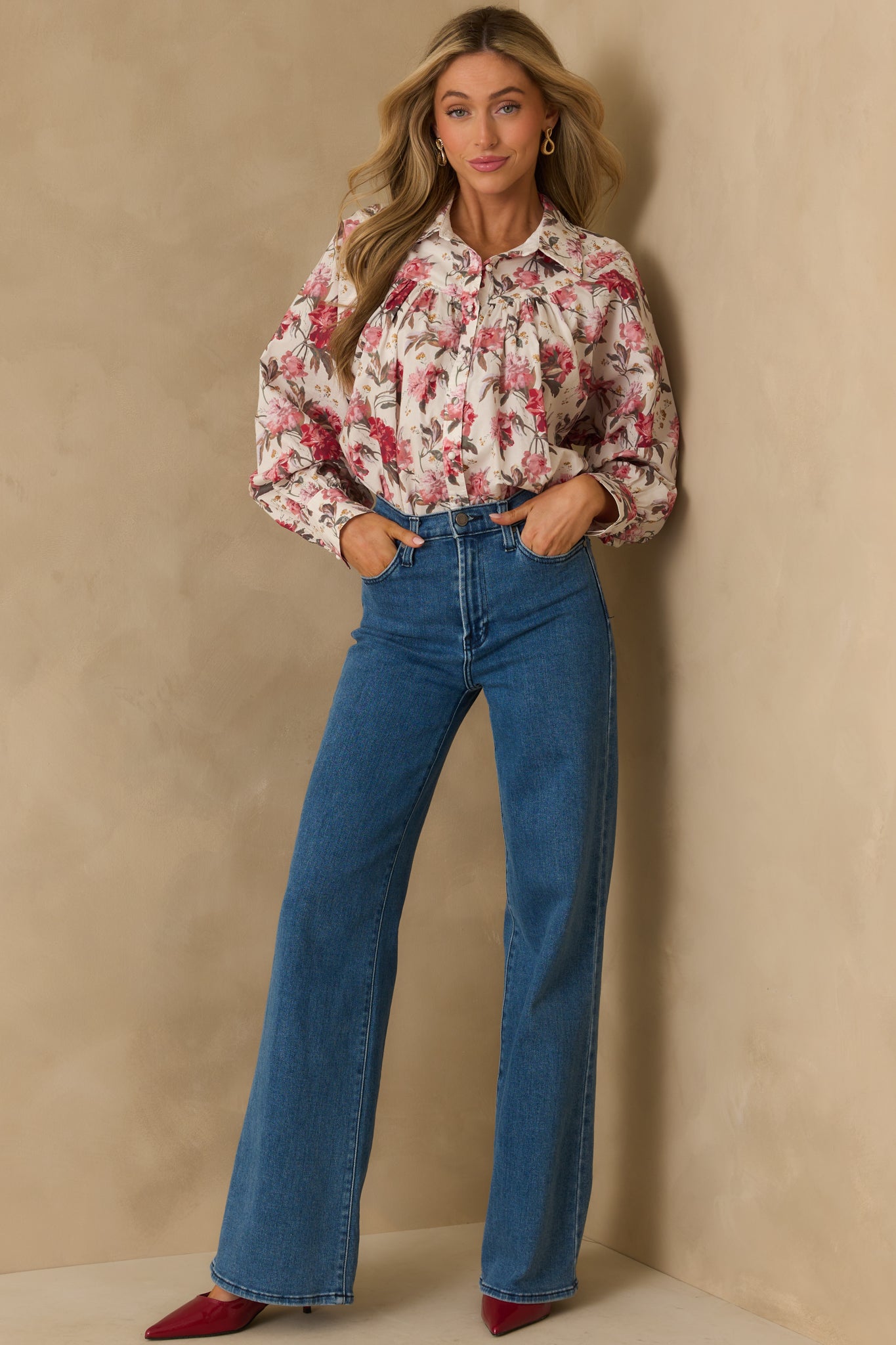 Front view of pink multicolor print top with collared neckline and button front.