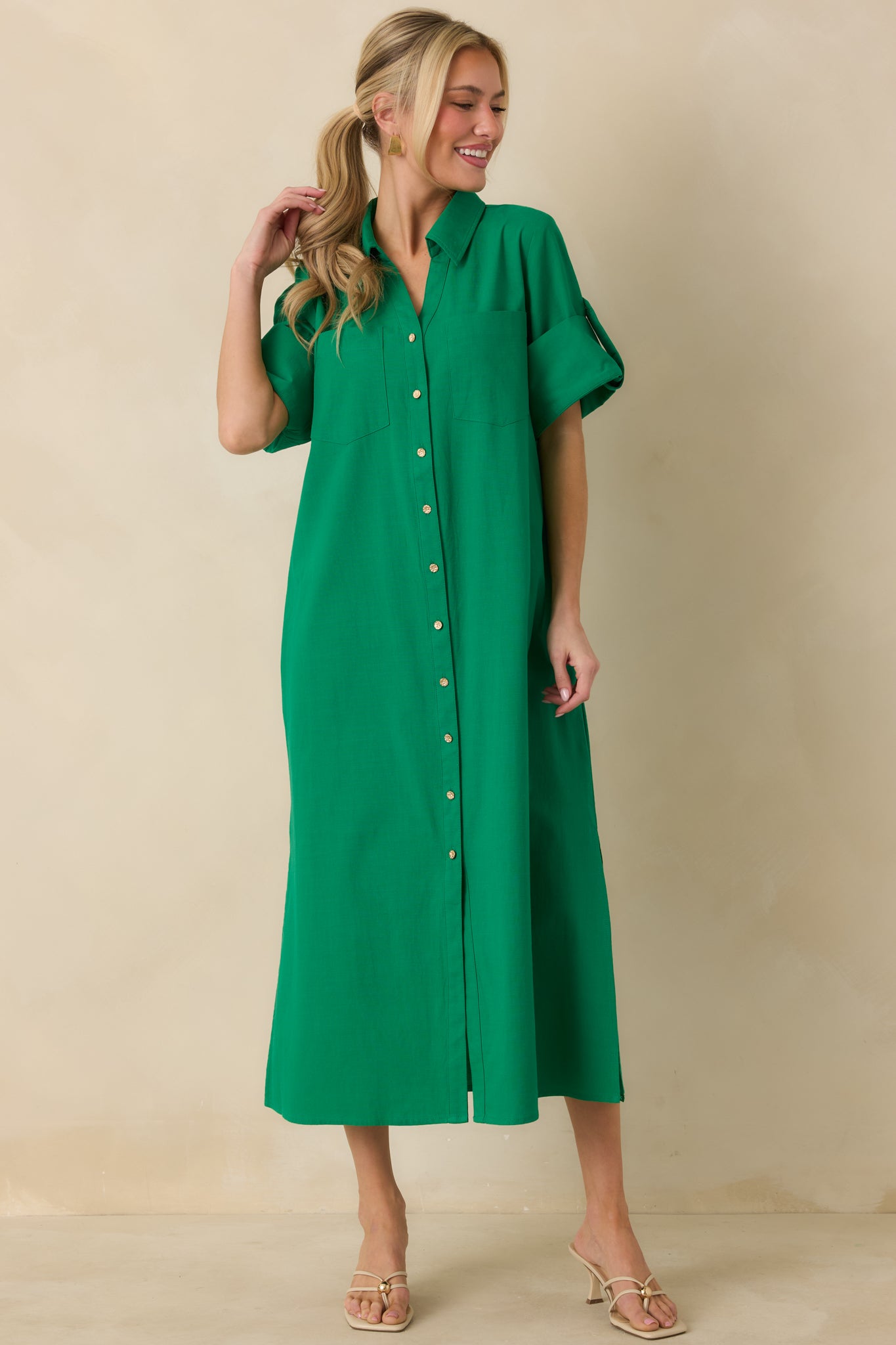 Straight-on front view of green midi shirt dress with long sleeves, relaxed fit, and breathable cotton texture.