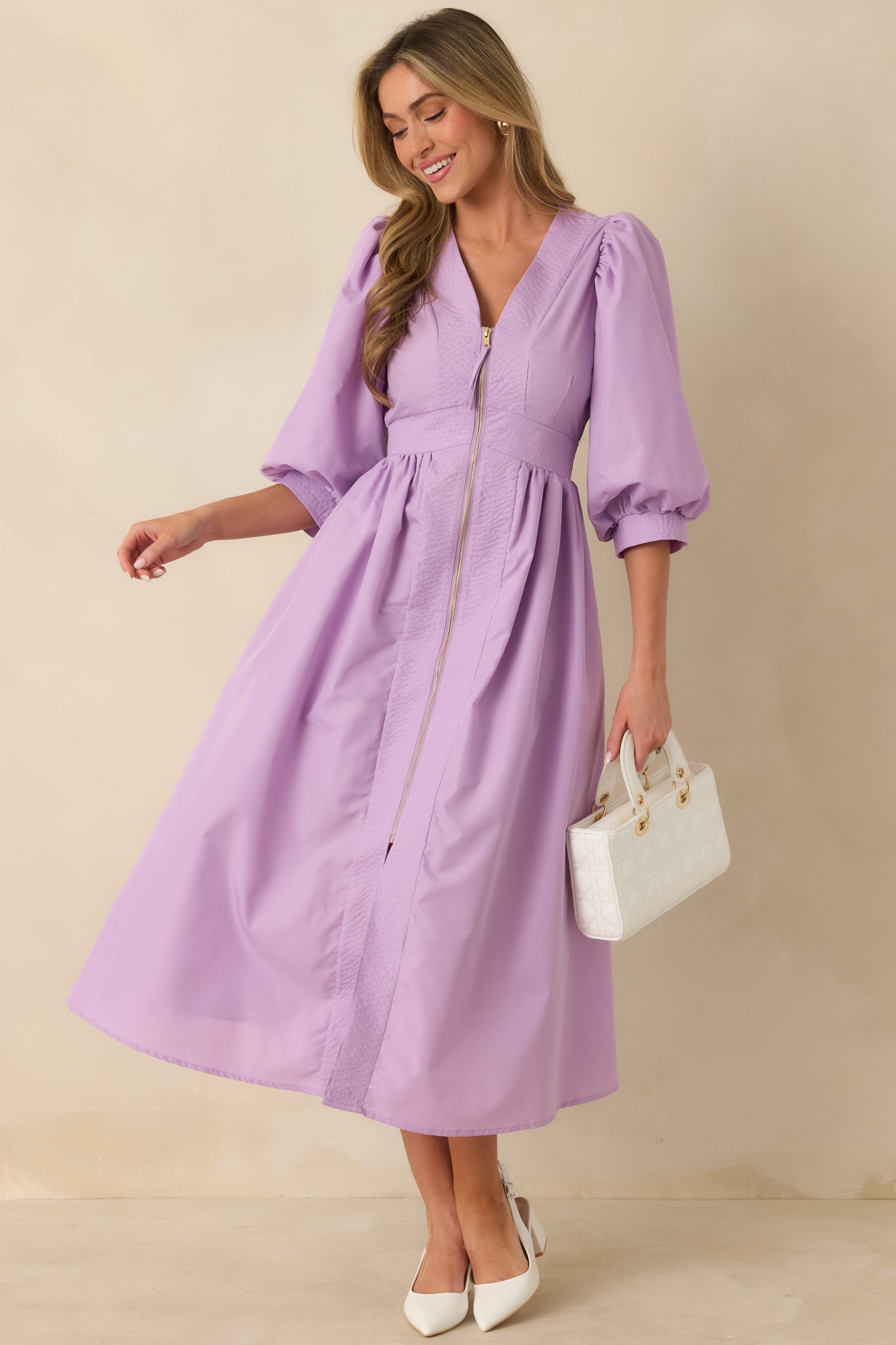 Full body front view of the lavender dress highlighting the fitted waist and smooth, fully lined midi skirt.
