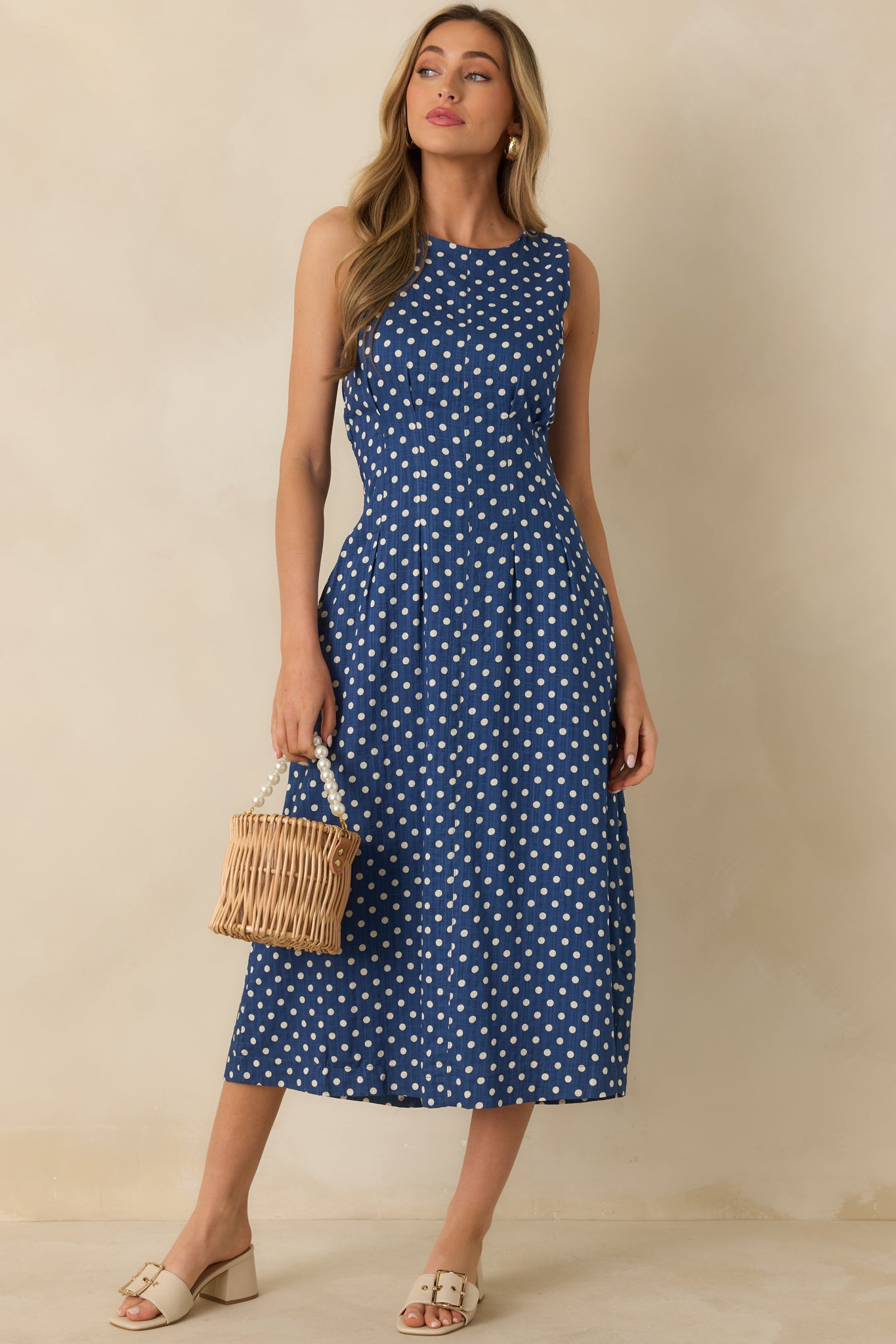 Front view showcasing the smooth bodice, polka dot pattern, and midi-length silhouette.