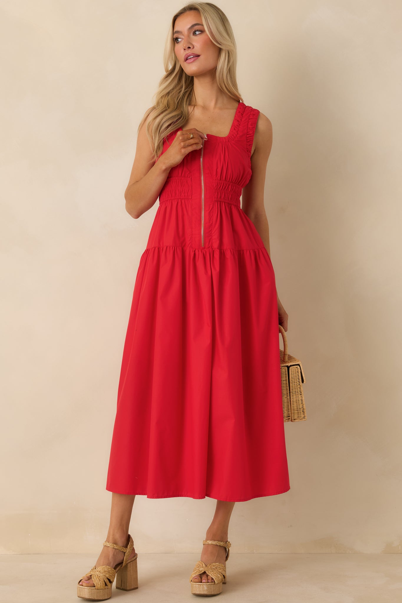 Front view showcasing the ruched trim detailing and clean sleeveless cut of the dress.