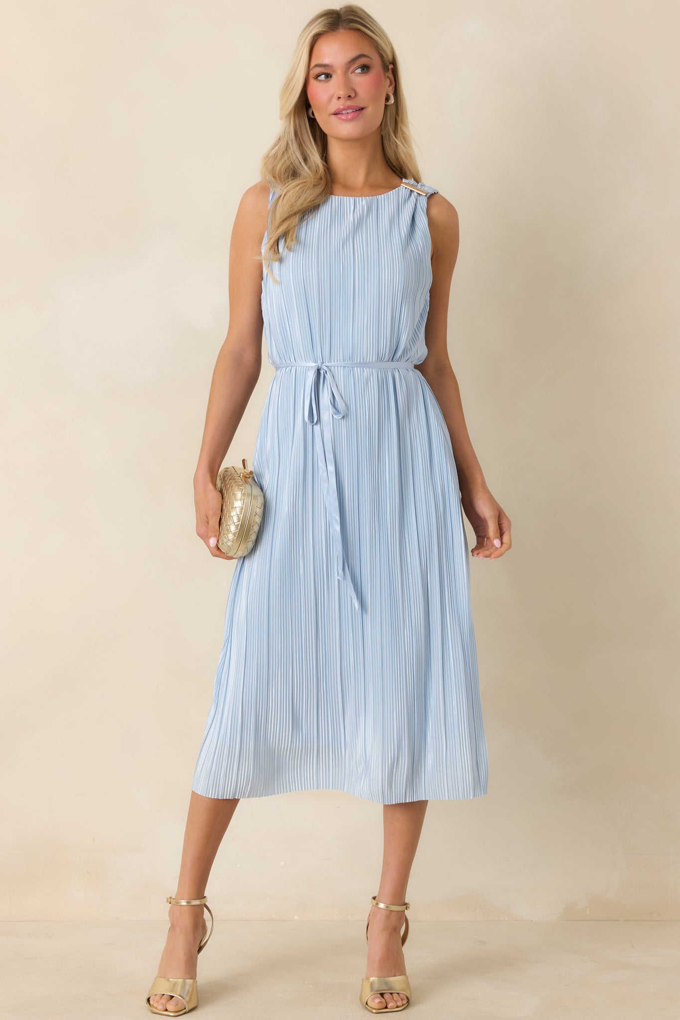 Front view showcasing gold shoulder accents and clean neckline detail.