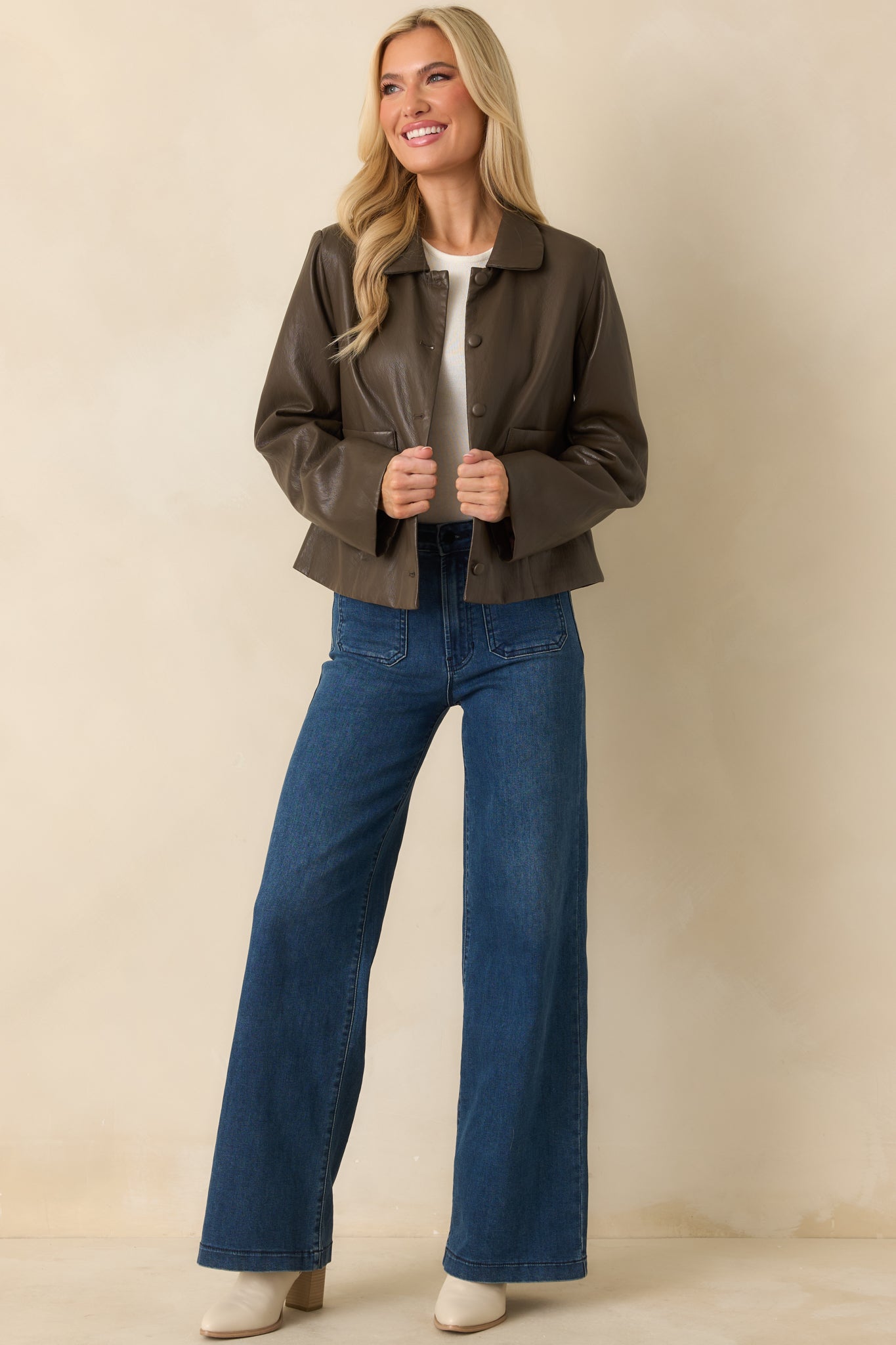 Straight-on front view showcasing hidden snap buttons, clean lines, and soft faux leather finish.