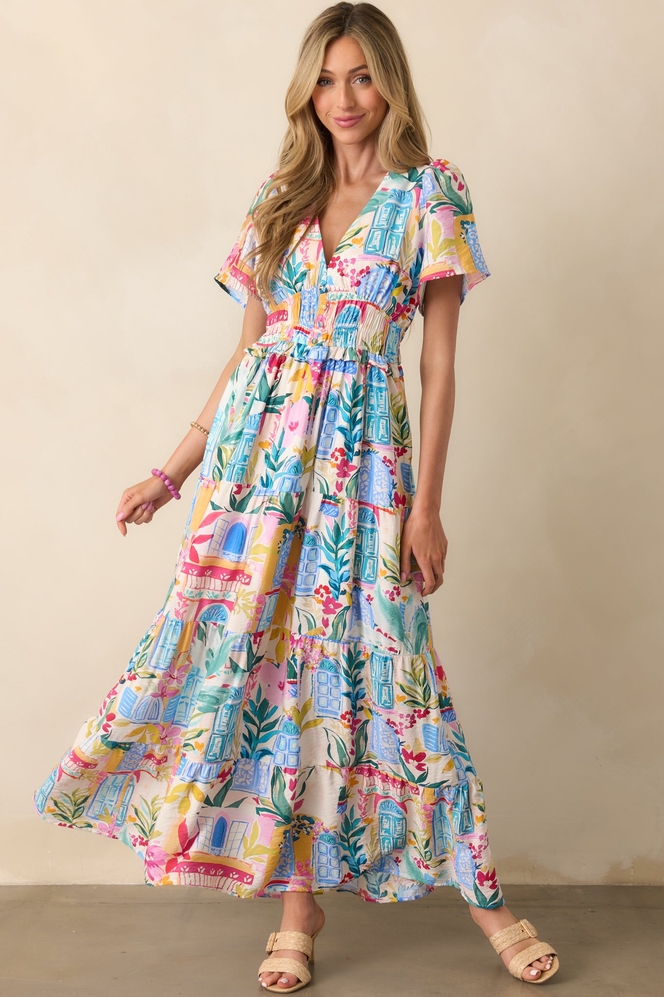 Slightly side-angled front view of the dress showing the placement of functional pockets and the subtle texture of the watercolor print.