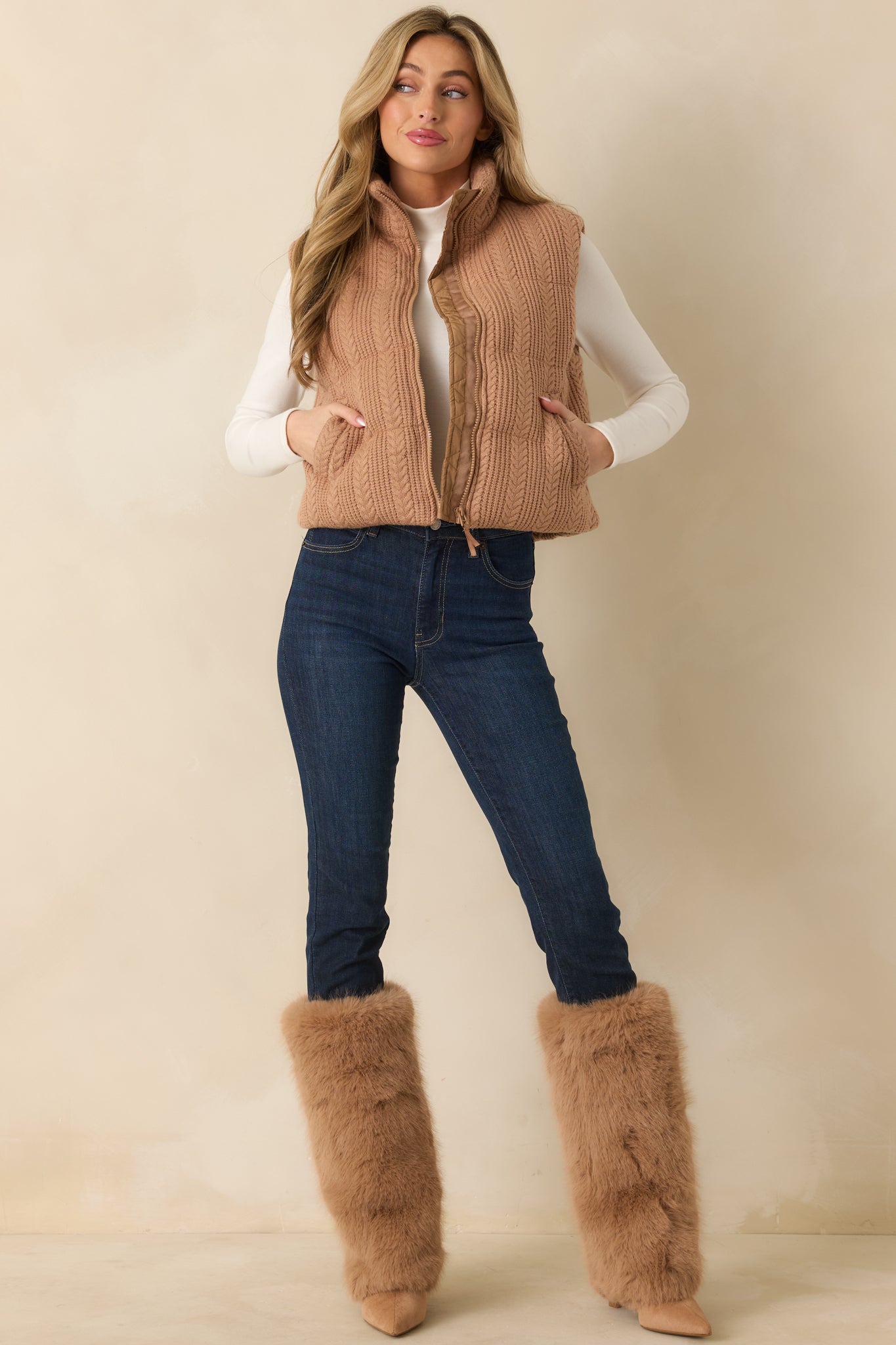 Straight-on front shot highlighting the sleeveless design, lightly padded body, and smooth interior lining.