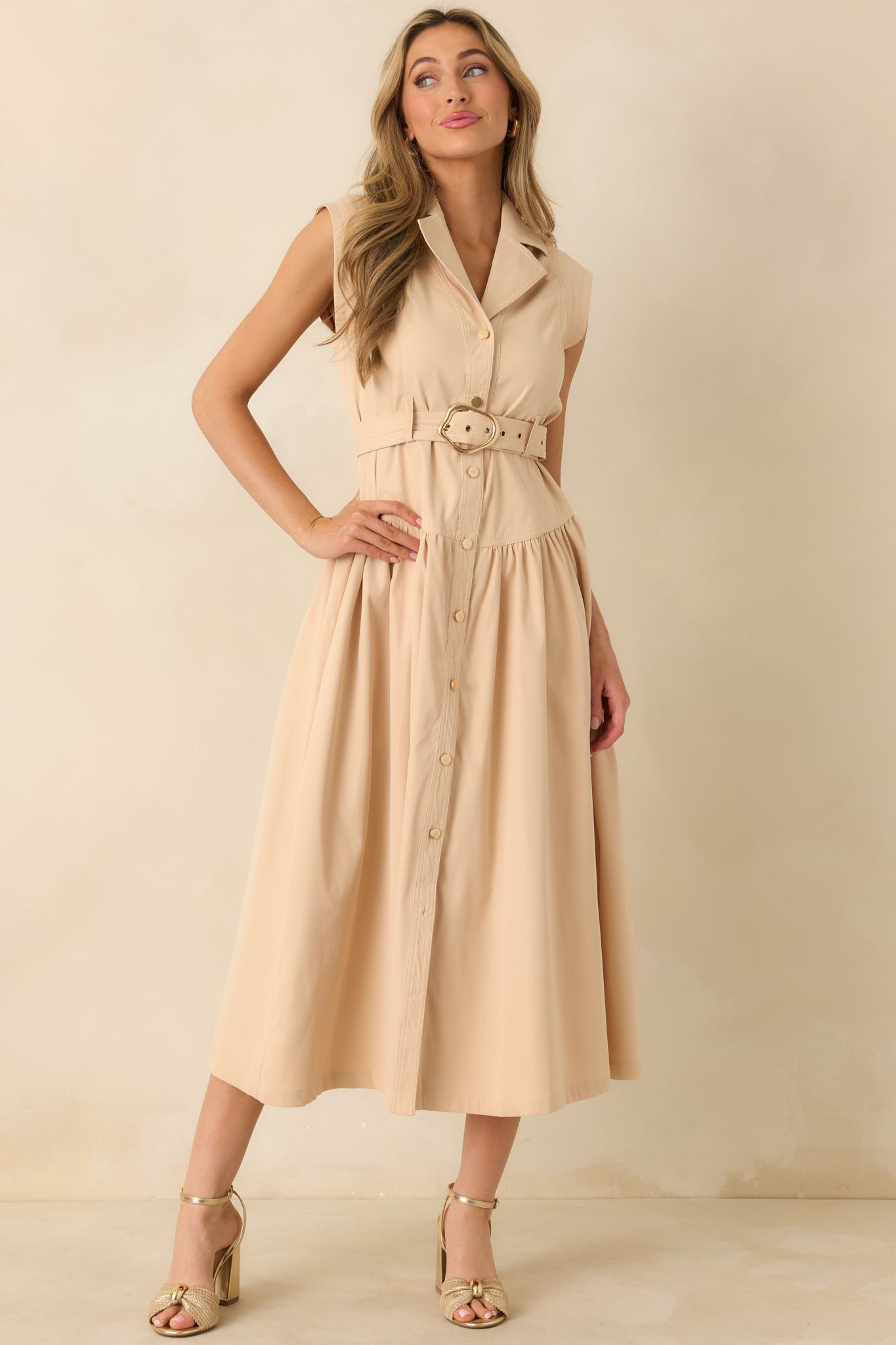 Front-facing angle emphasizing the sleeveless cut, tailored waist, and fluid movement of the gathered skirt.