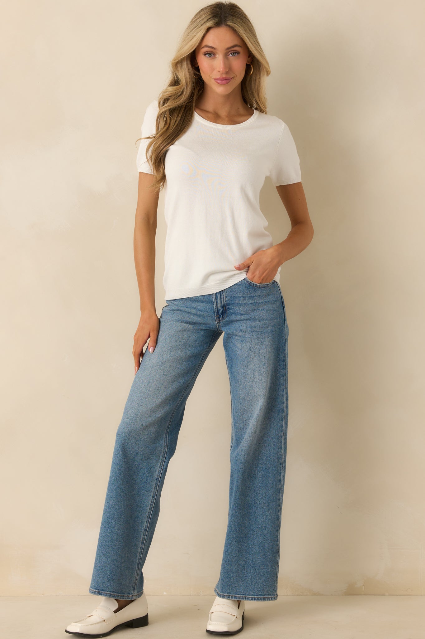 Front view of the top highlighting the soft sweater fabric and ribbed hem.