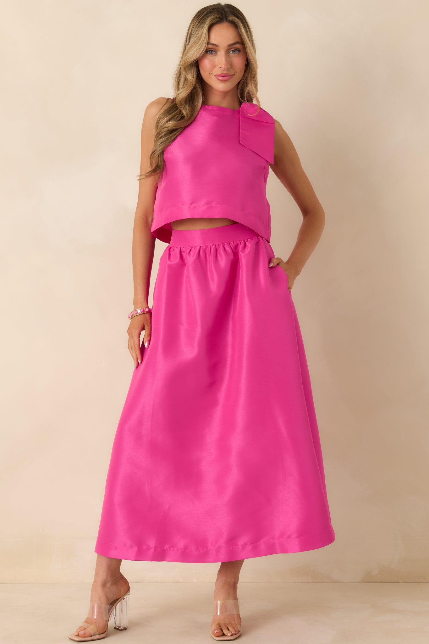 Front view showcasing the structured woven construction and polished finish of the sleeveless top.