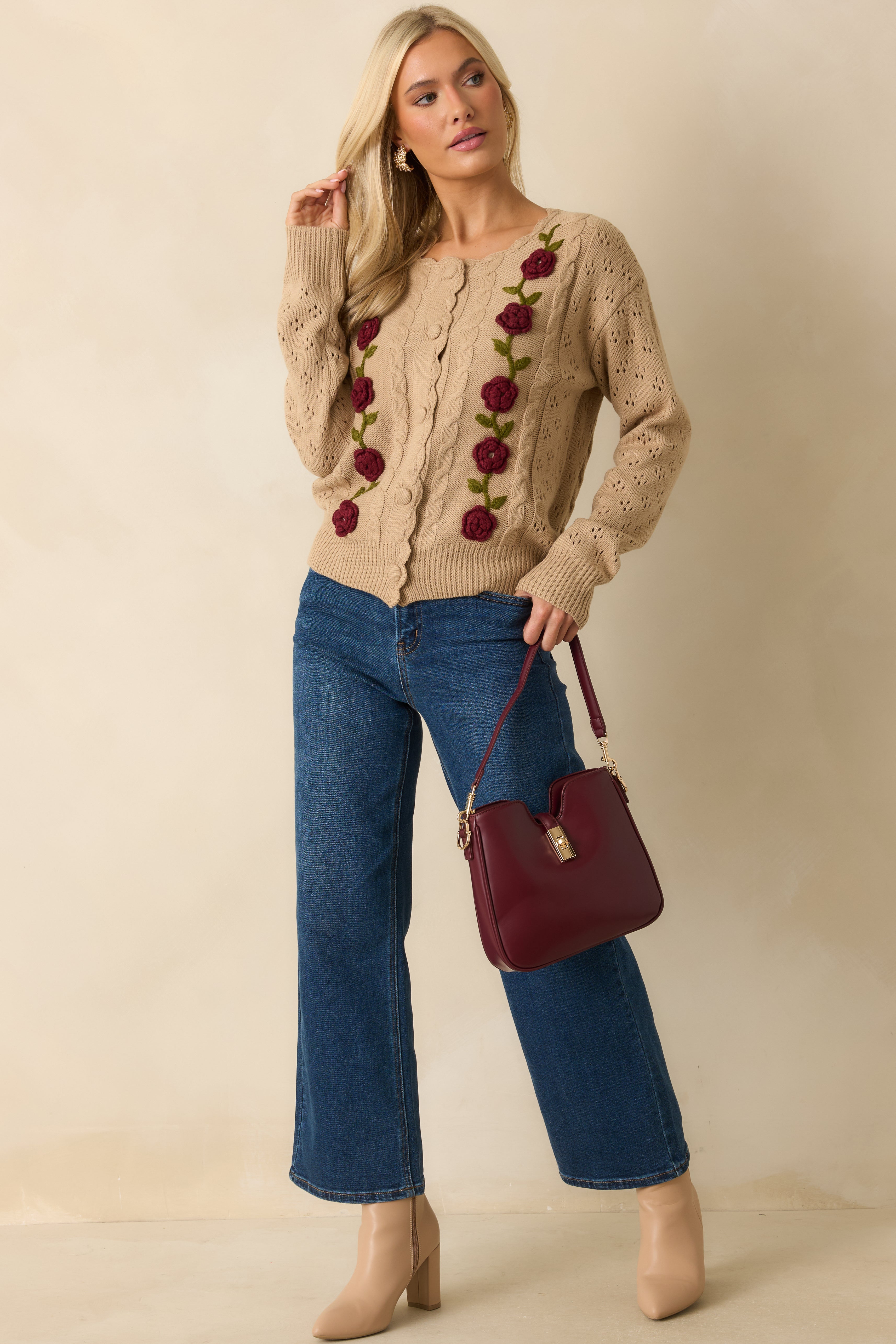 Front view of the taupe cardigan showing the cable-knit front, long sleeves, and tonal button closures.