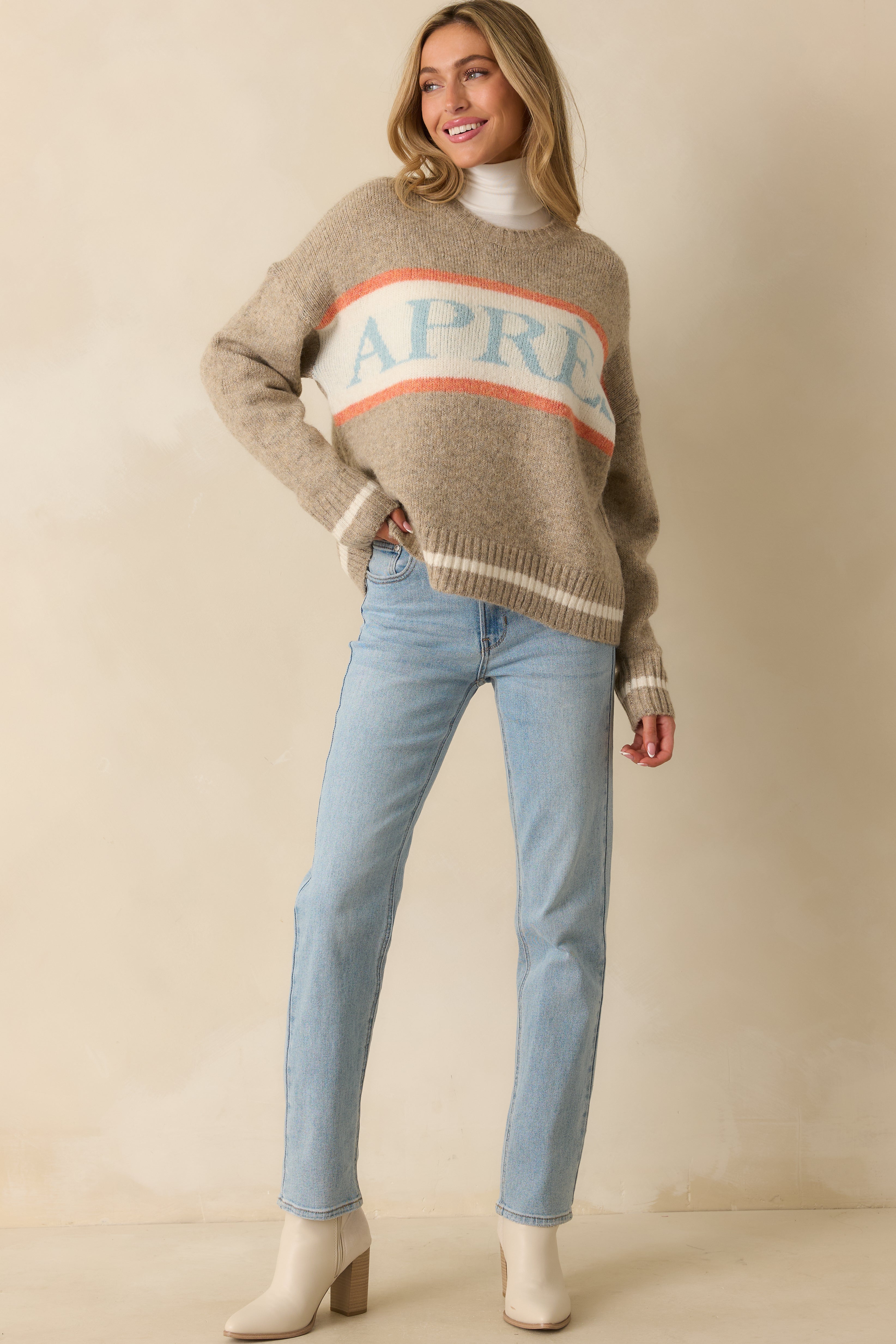 Front view of taupe long-sleeve pullover highlighting stripe accents, ribbed trim, and loose, comfortable fit.