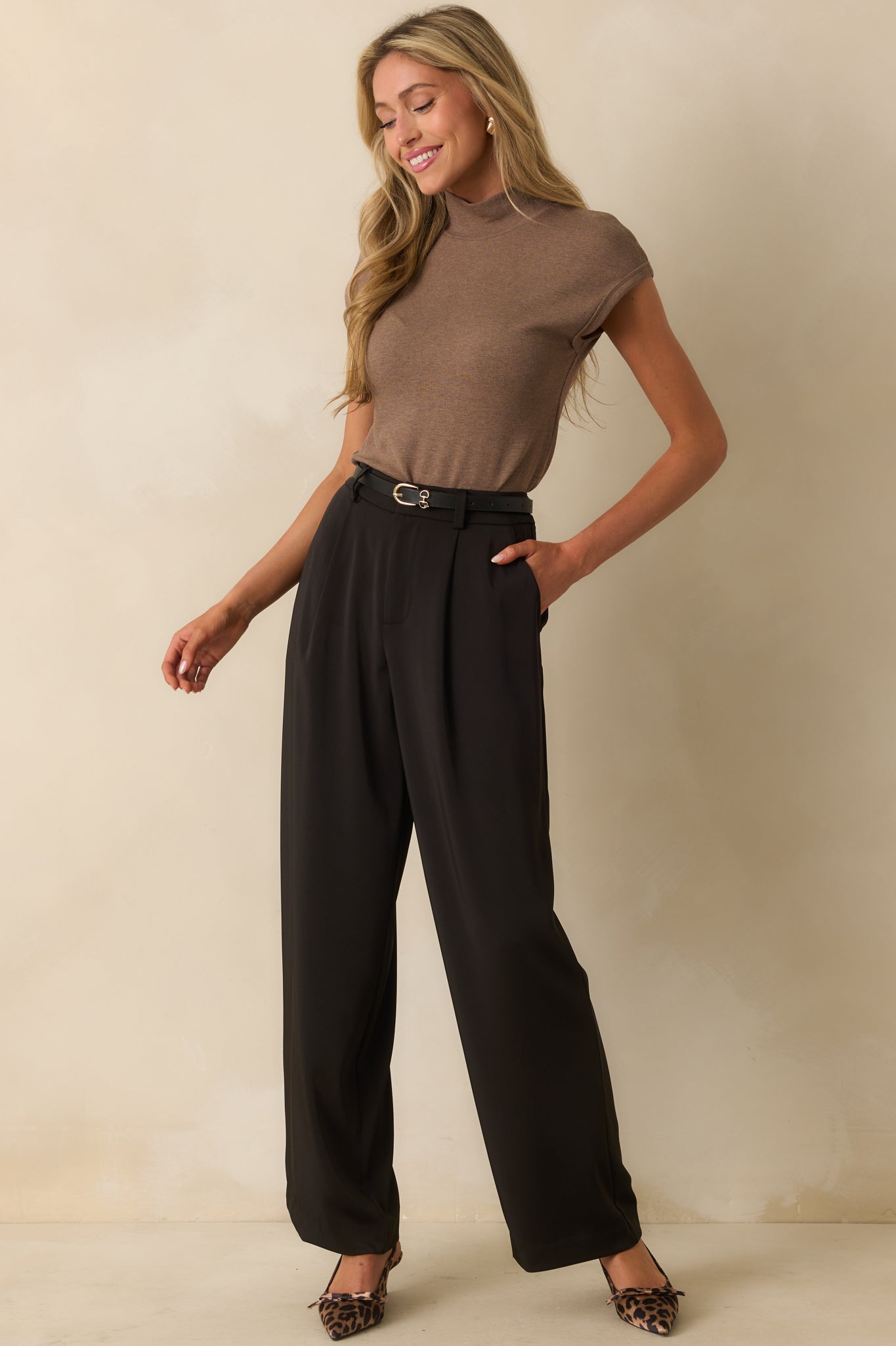 Front view of top showing its straight hem and slim, flattering fit.