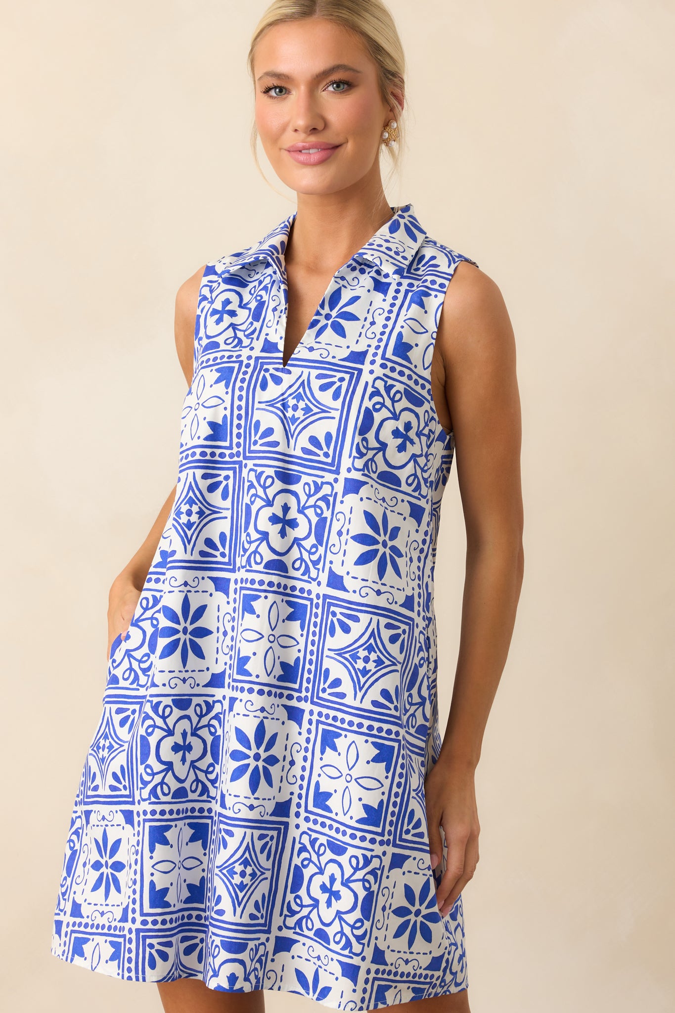 Frontal image of the dress highlighting its relaxed silhouette, mini length, and intricate tile pattern.