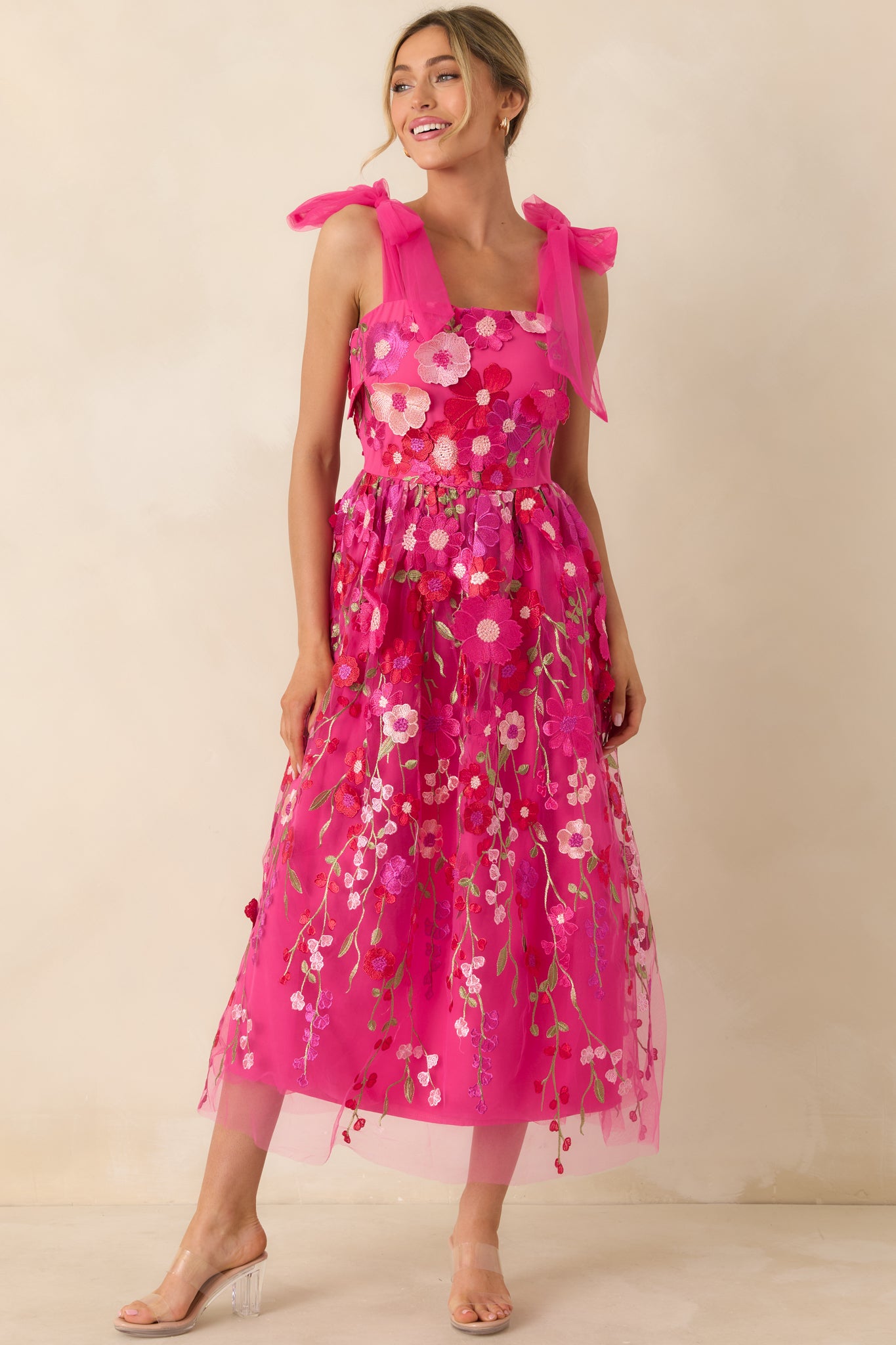 Front-facing full body photo showing the allover floral embroidery and airy, structured fit.