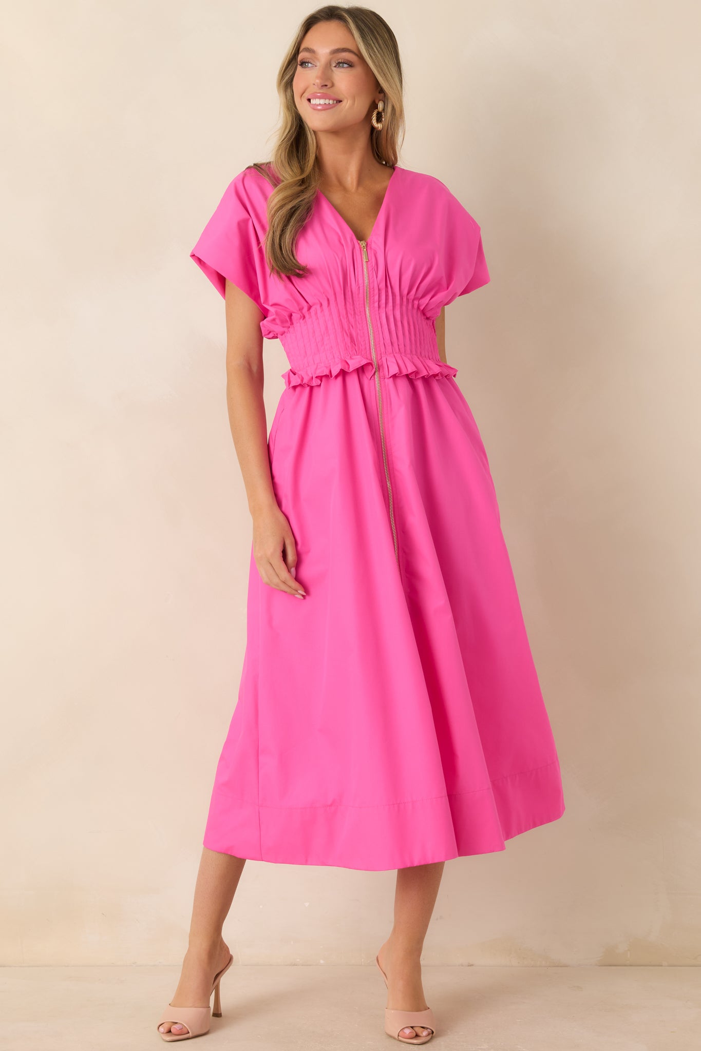 Fuchsia maxi dress featuring a V-neckline, front zip closure, and relaxed A-line silhouette.