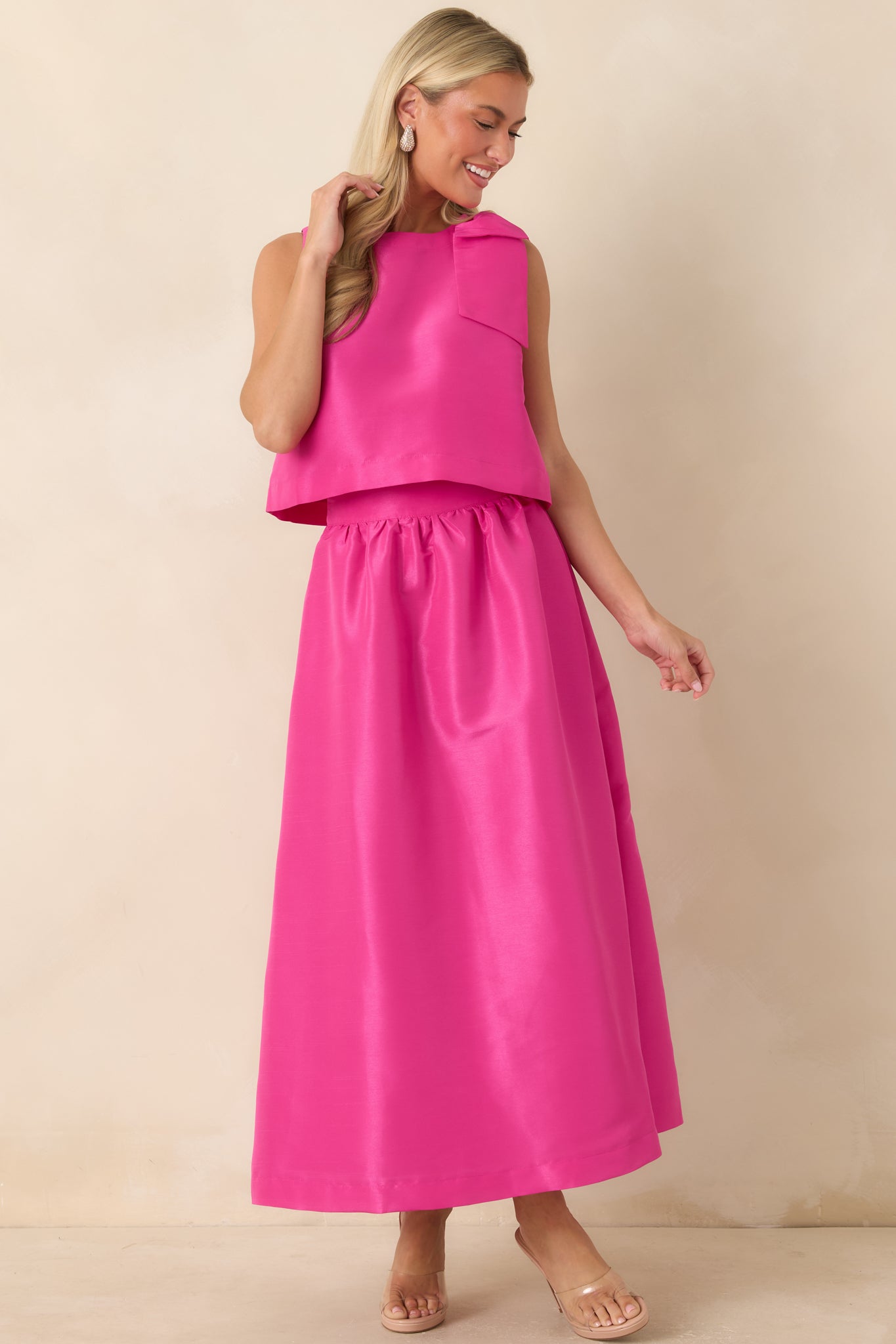 Fuchsia pink maxi skirt featuring a high-rise waistband, gathered waist detail, and full-length silhouette.