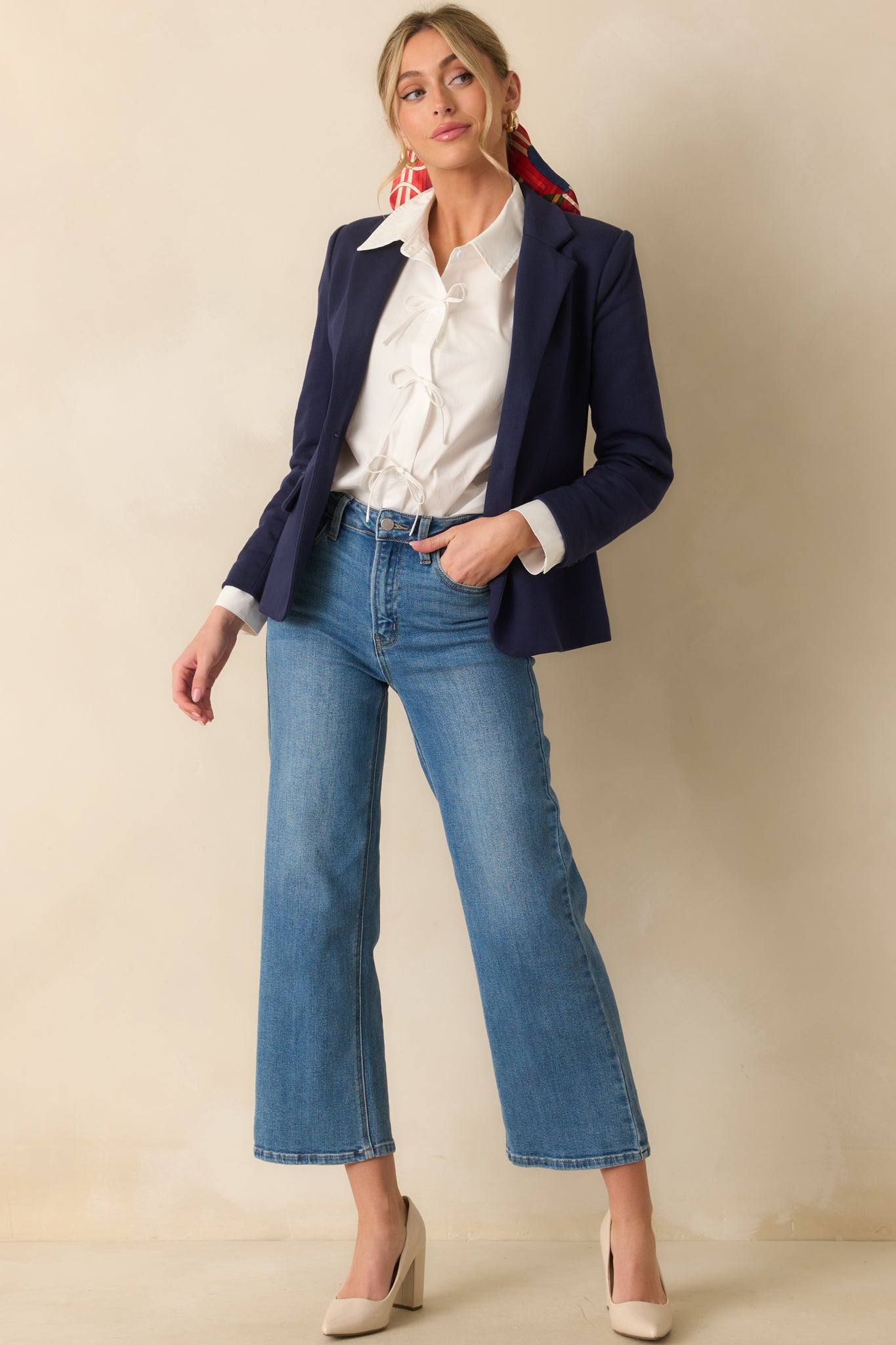 A full body angle showing the shoulder pads and placement of the faux pockets.