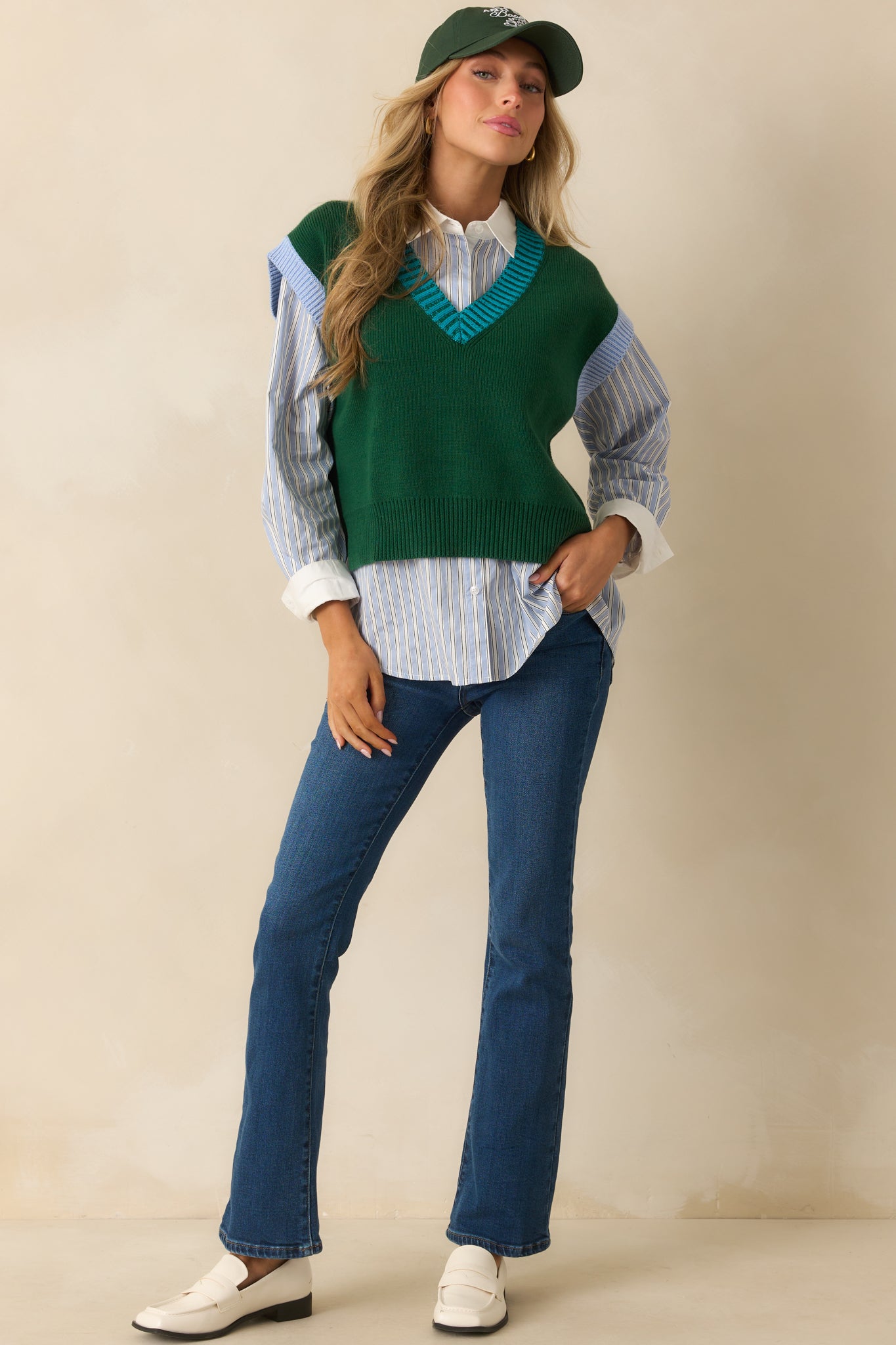 A full body photo highlighting the light blue cap sleeve cuffs and straight silhouette.