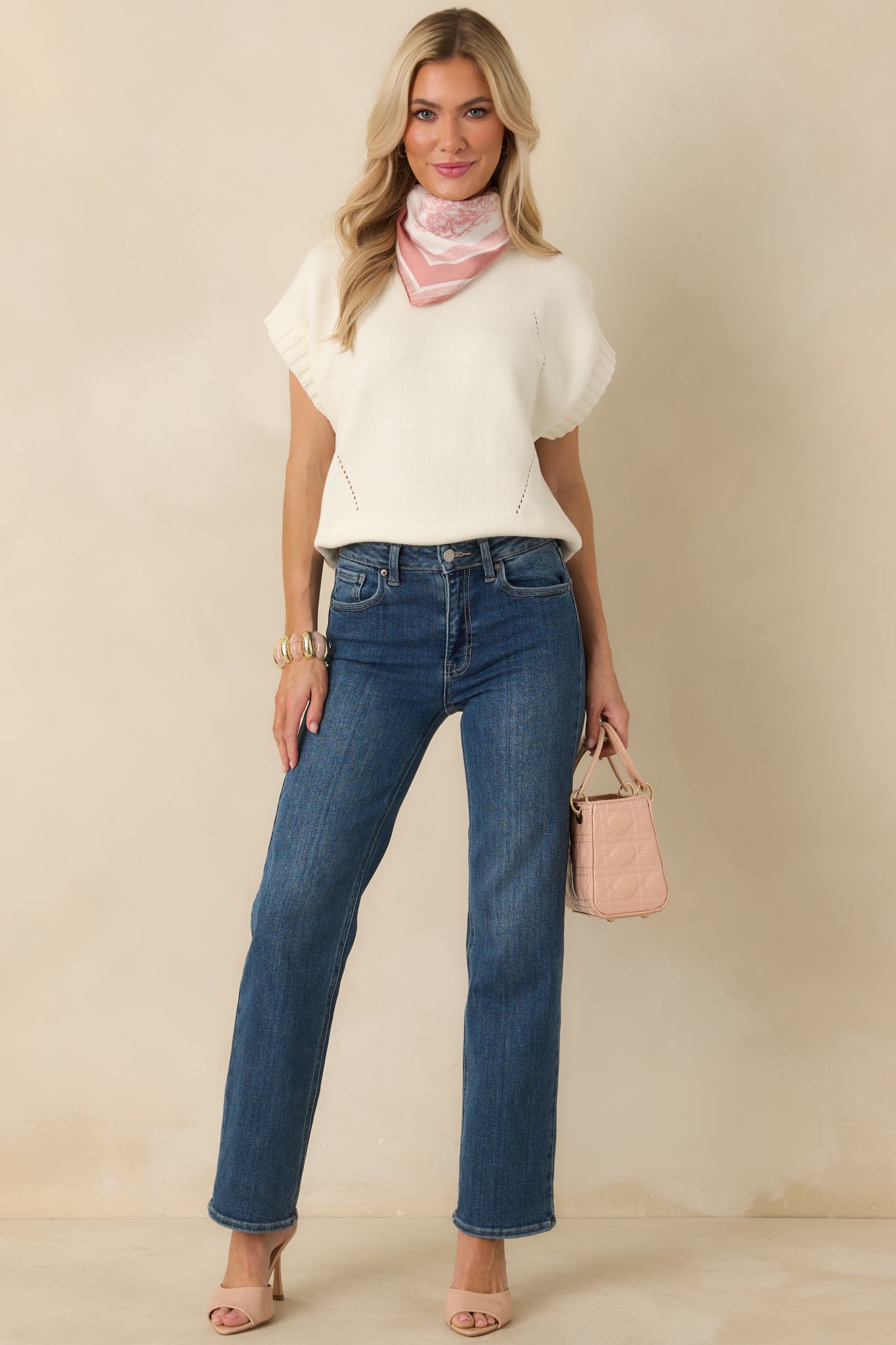 Front-facing full body photo showcasing the short sleeves and subtle knit texture throughout.