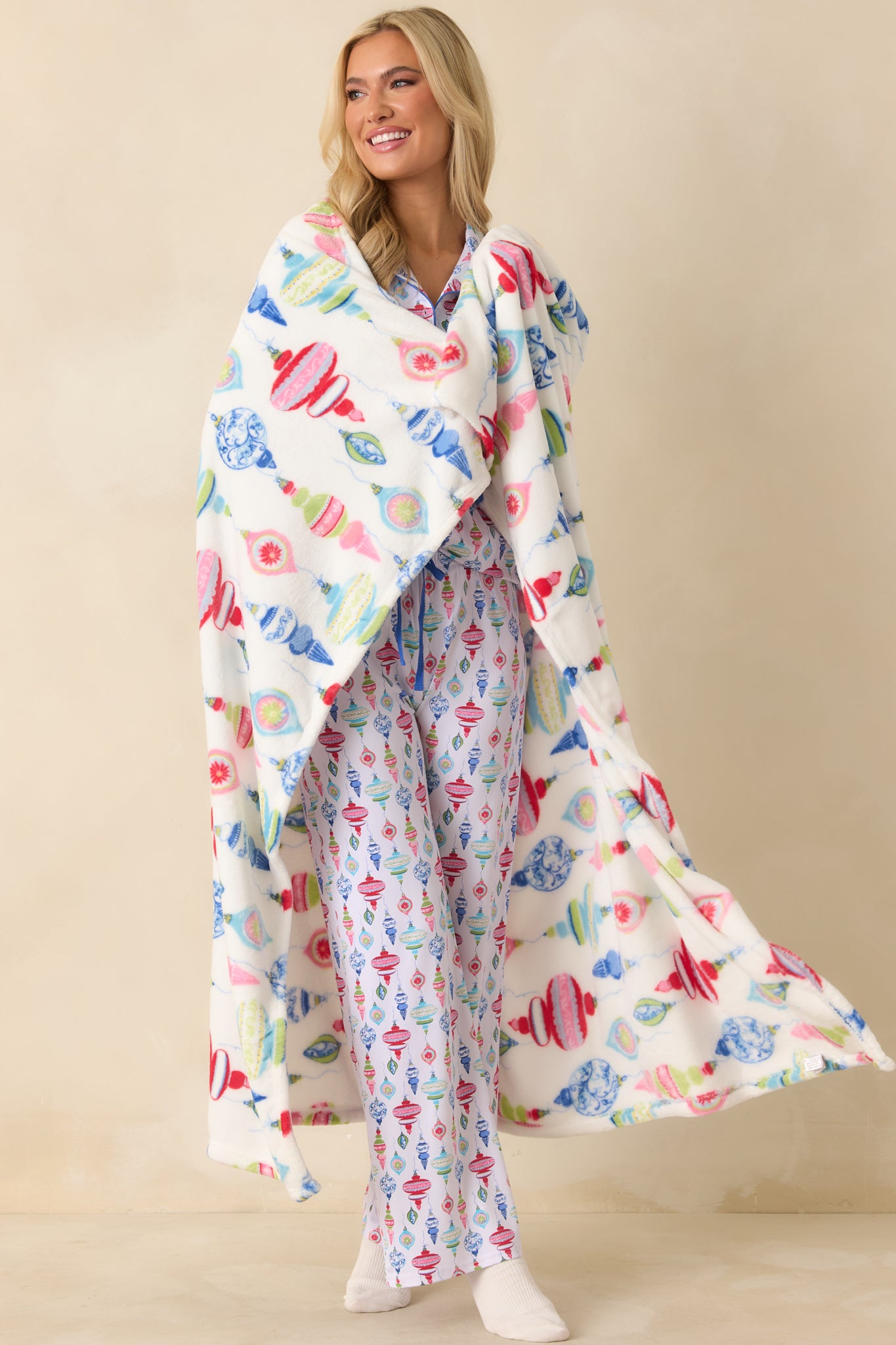 Full-body view focusing on the red and blue ornaments and smooth fabric texture.