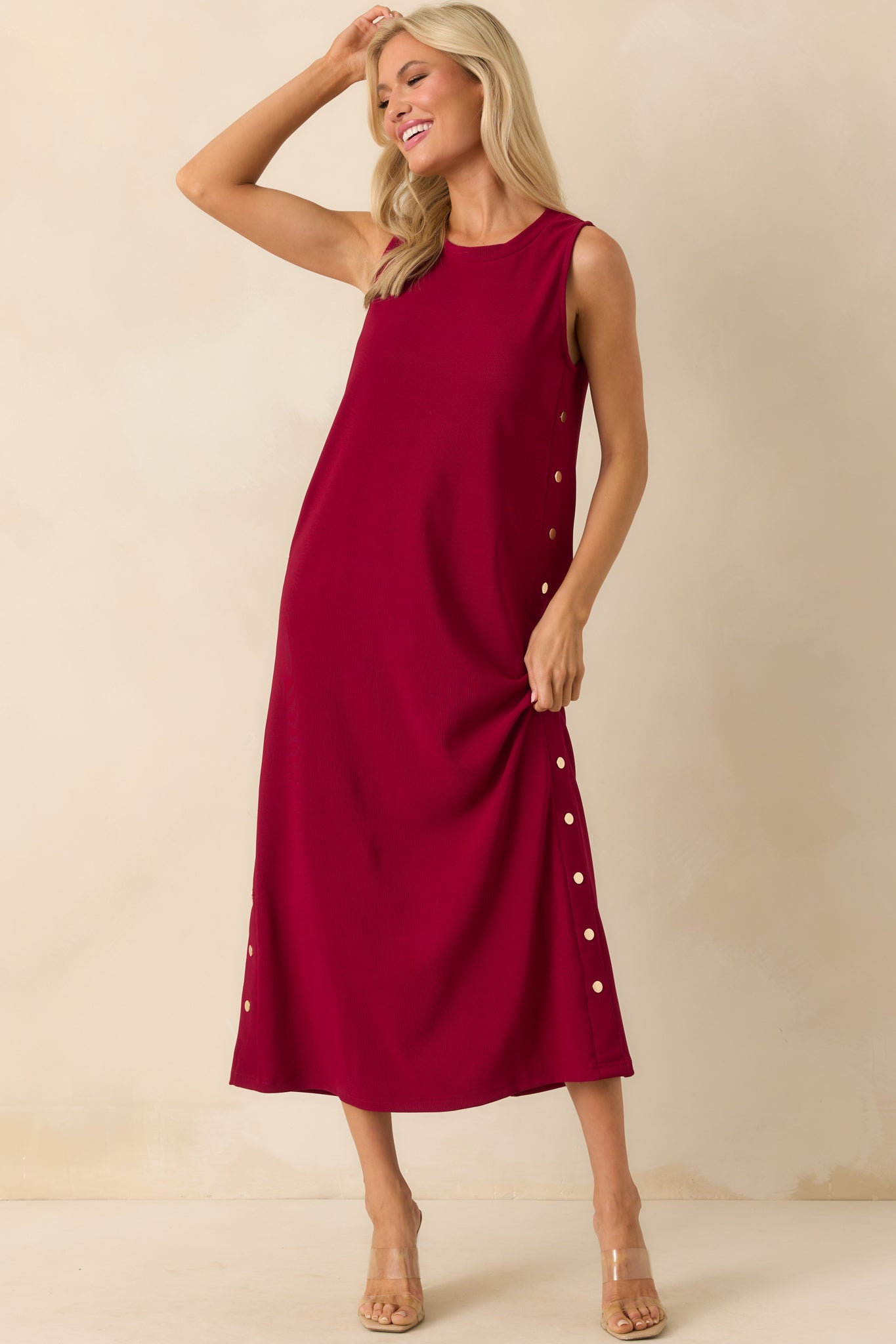 Full body shot emphasizing the smooth silhouette and flow of the maxi length dress.