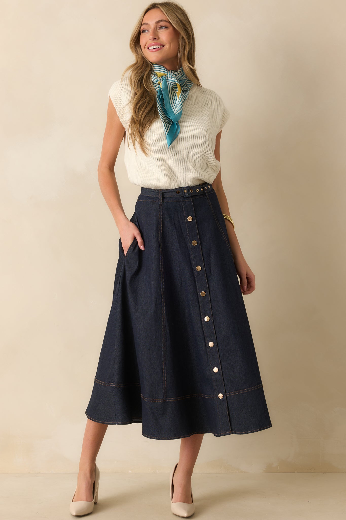 A full body shot highlighting the optional adjustable belt and paneled design of the skirt.