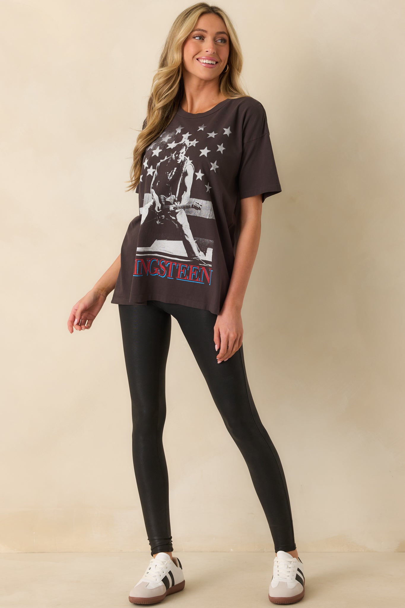 A full body image focusing on the straight hemline and placement of the front star-accented design.