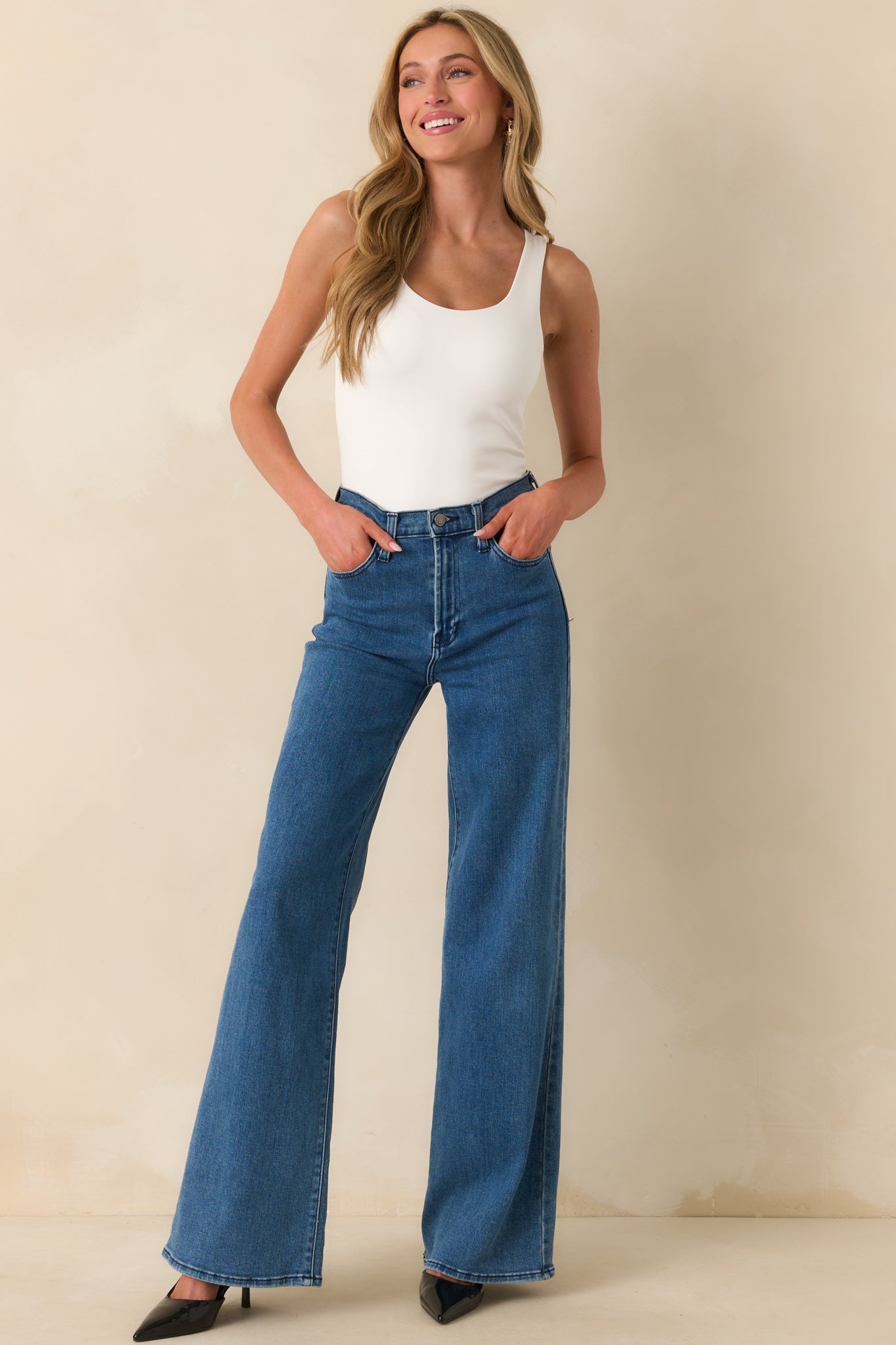 Full body front view of the ivory bodysuit showcasing the scoop neckline and sleeveless tank-style design.