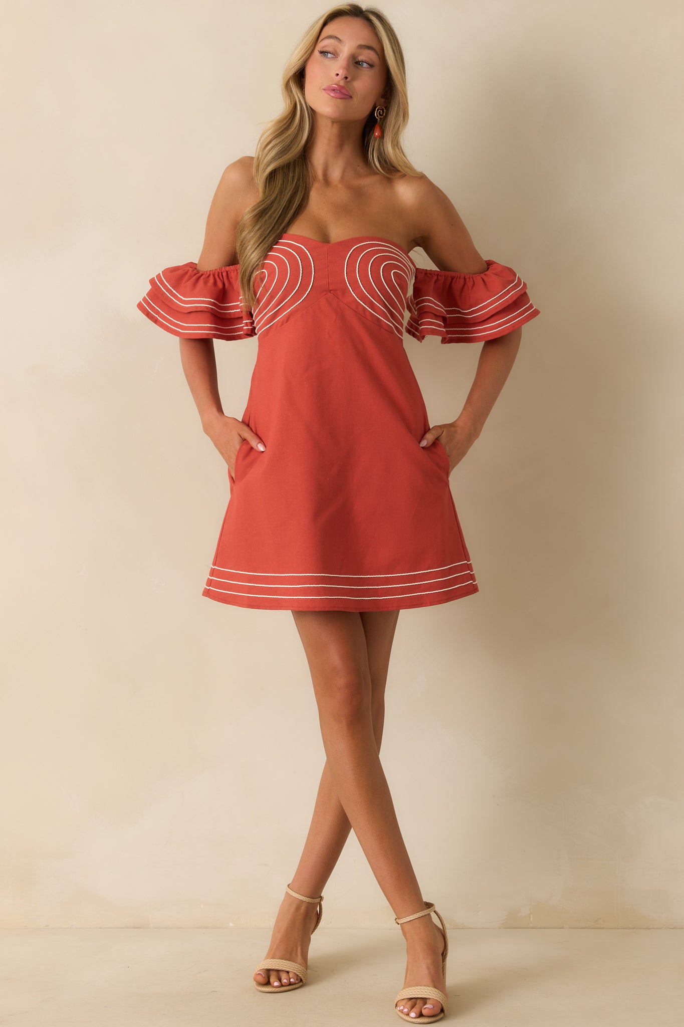 A full body view showing the functional pockets and smooth full lining beneath the dress.