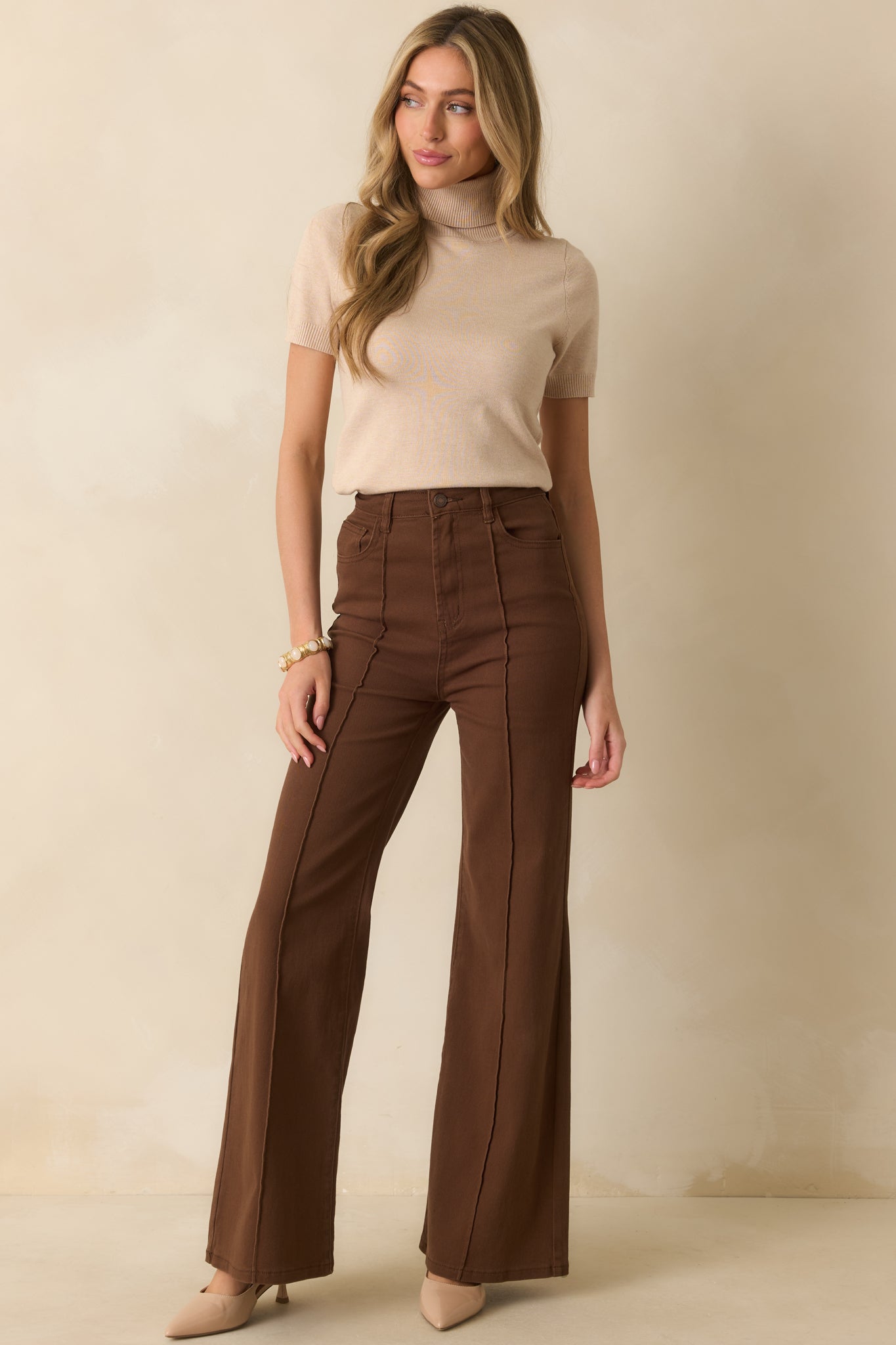 A full front view showing the smooth flare shape and button zip fly closure.