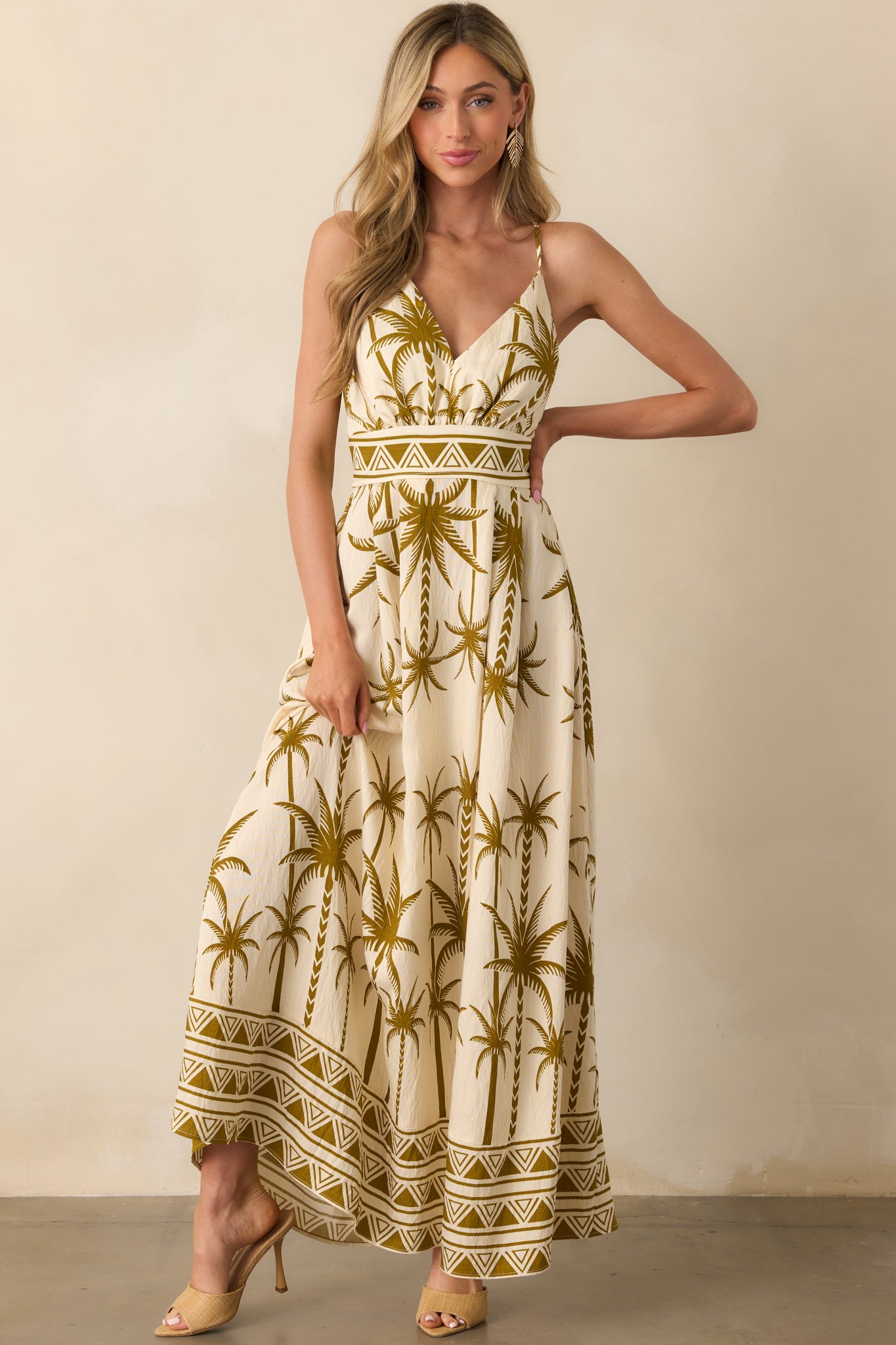 Full body image emphasizing the length and flow of the skirt and the placement of the tropical print.
