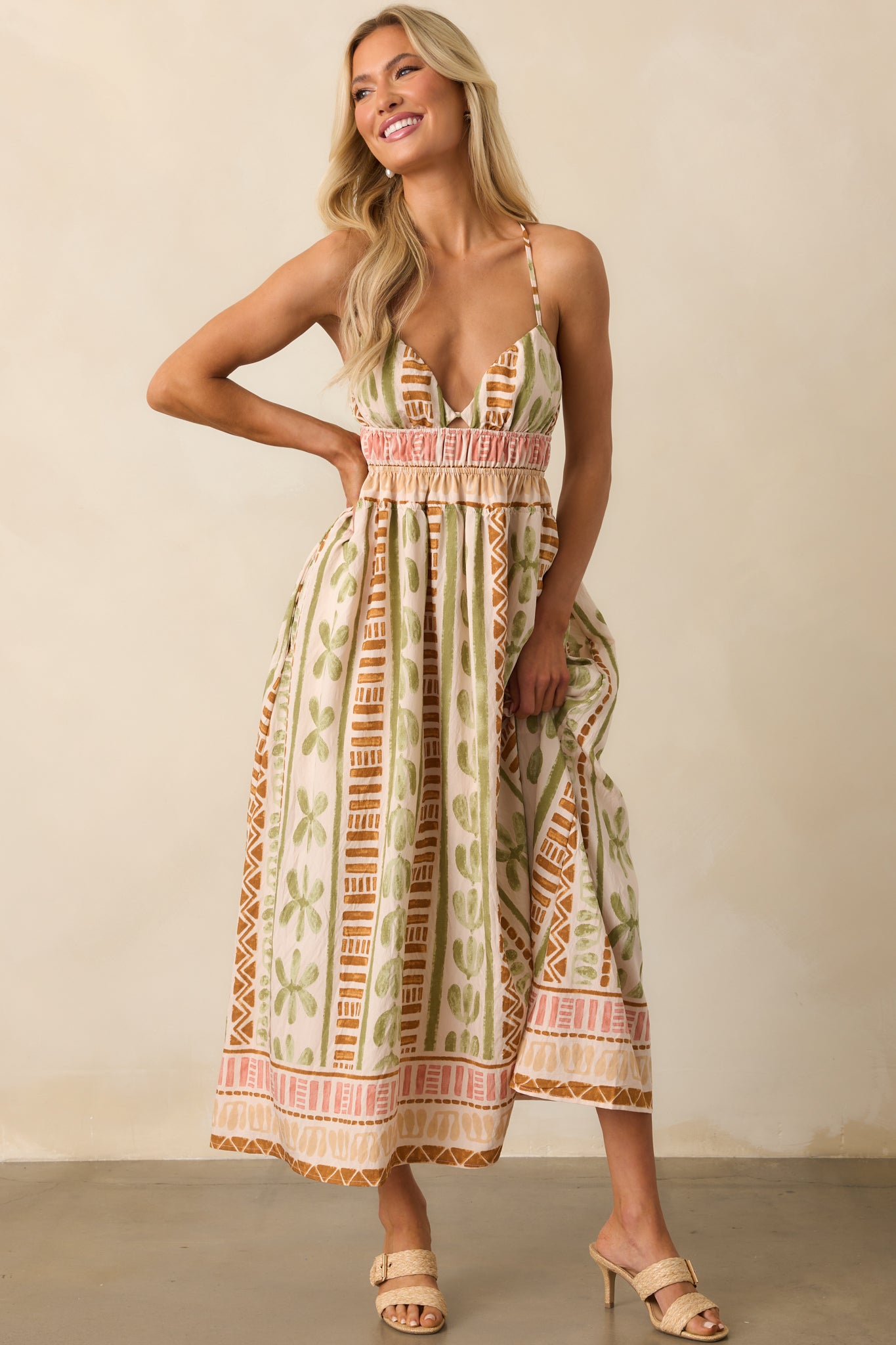 Full outfit image highlighting the deep neckline, pocket placement, and breezy structure of the maxi dress.