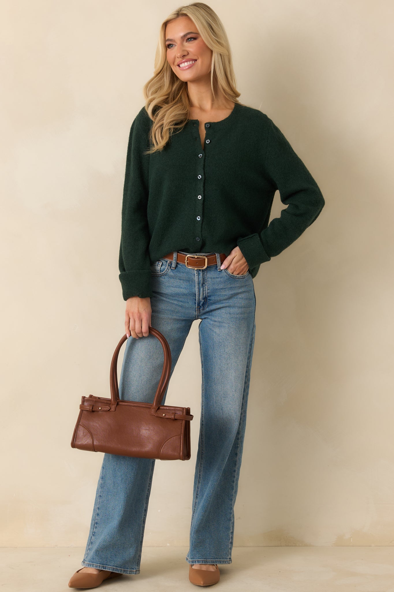 Full-length front view emphasizing button closure and ribbed cuffs and hem.