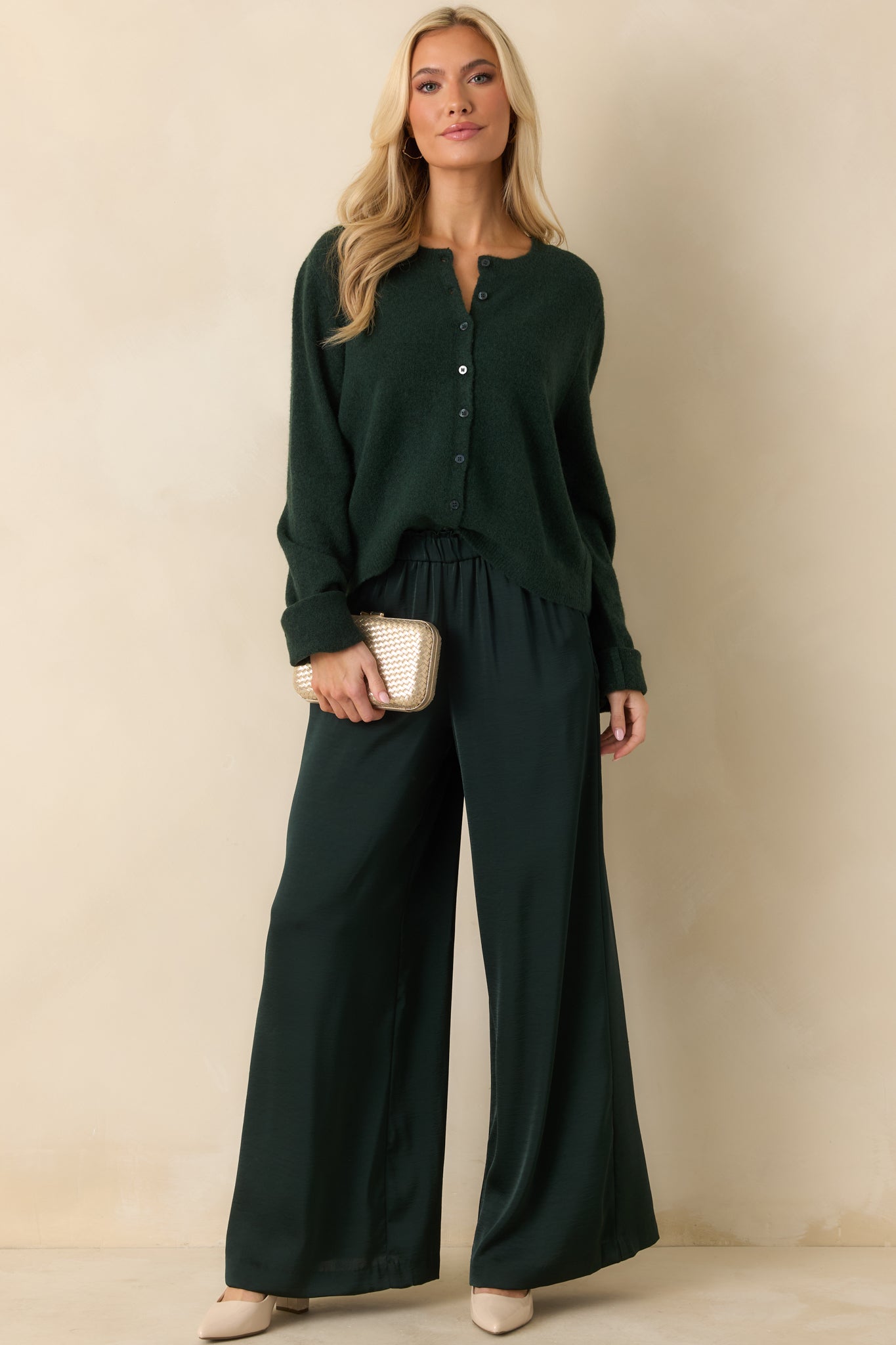 Full-length front perspective emphasizing flowy wide-leg cut and polished satin finish.