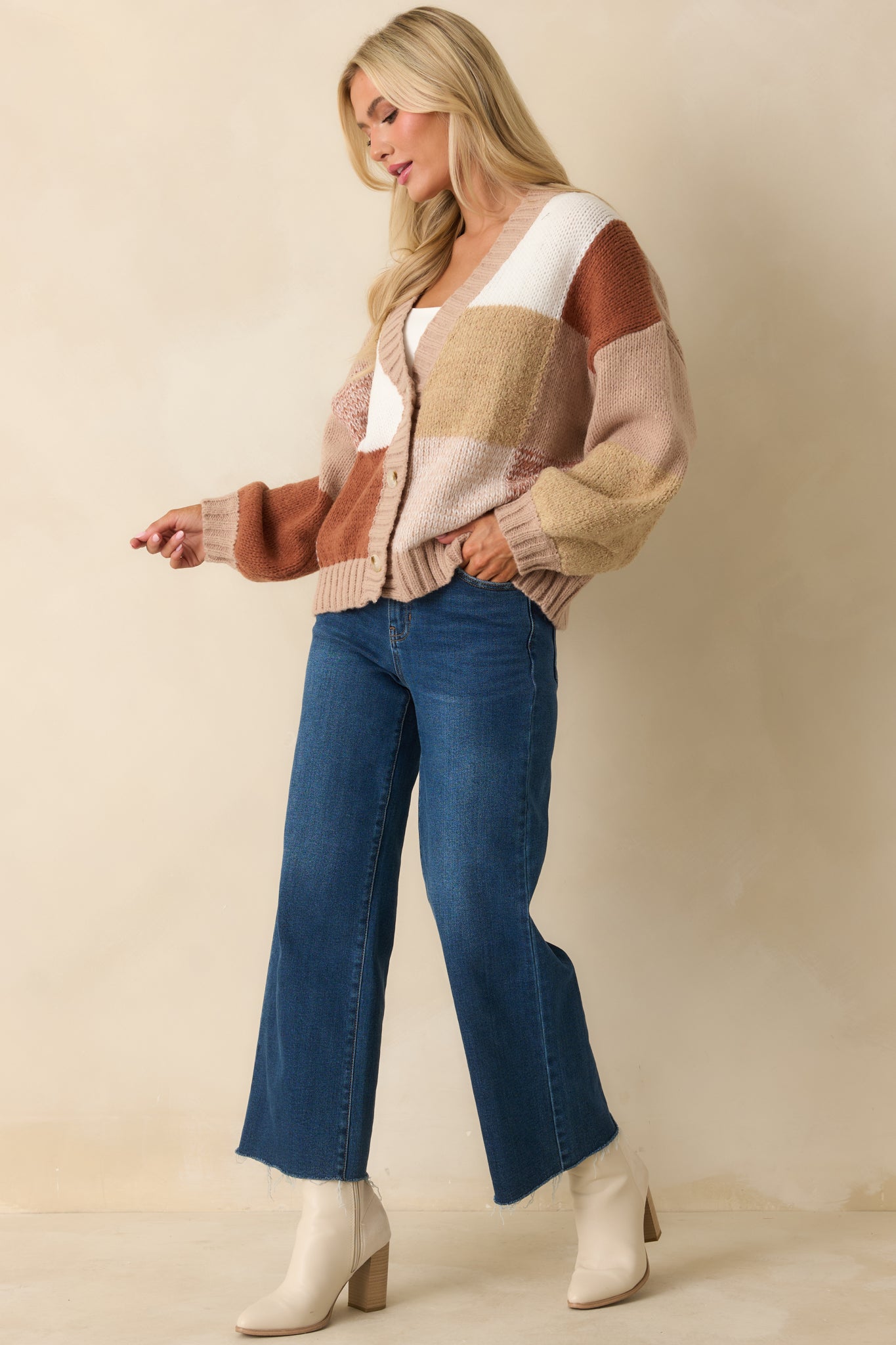 Full-length front view of relaxed taupe knit cardigan featuring buttoned front and soft, slouchy fit.